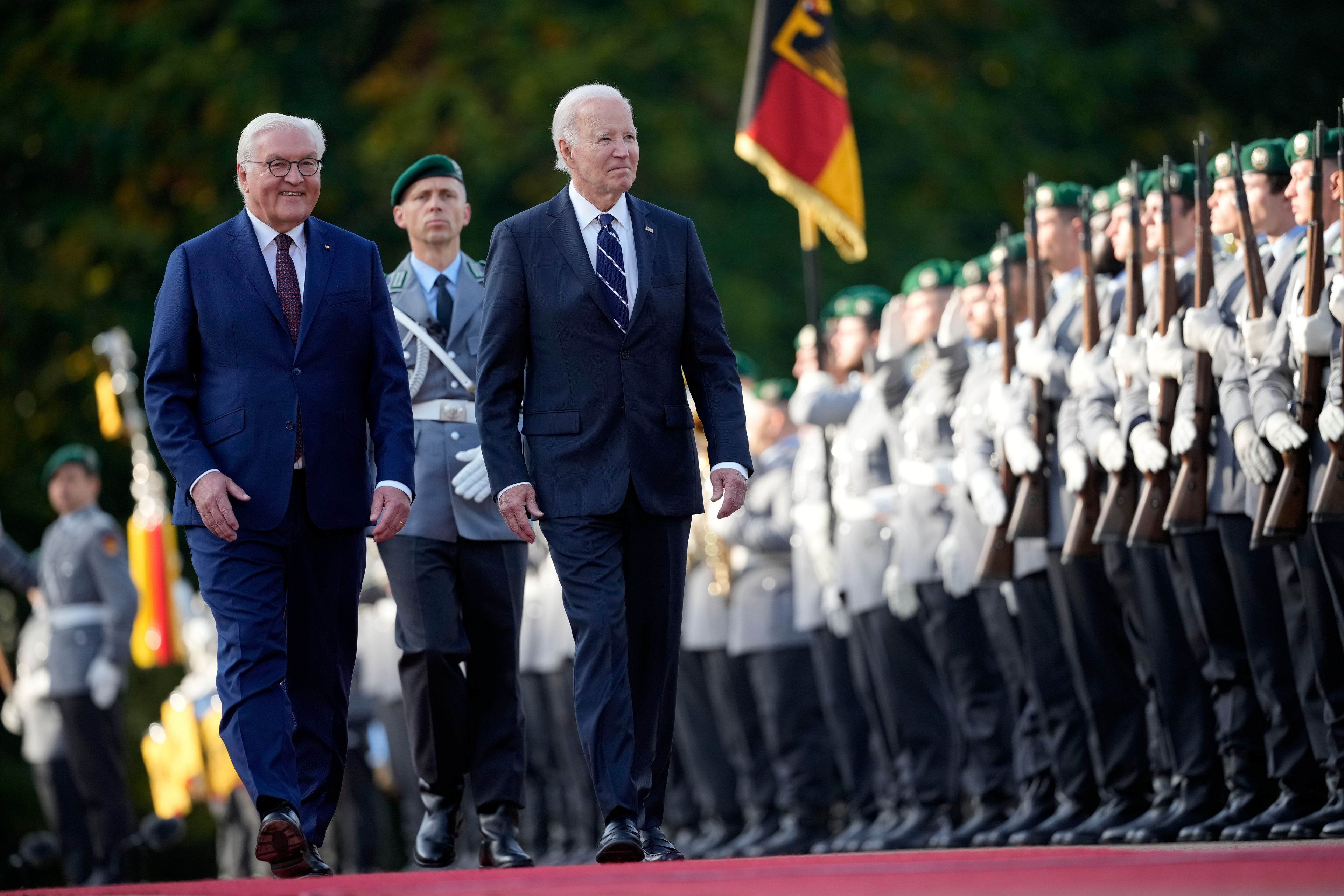 President Joe Biden and German President Frank-Walter Steinmeier inspect the military honour guard during the welcoming ceremony at Bellevue Palace in Berlin, Germany, Friday, Oct. 18, 2024. (AP Photo/Ebrahim Noroozi)