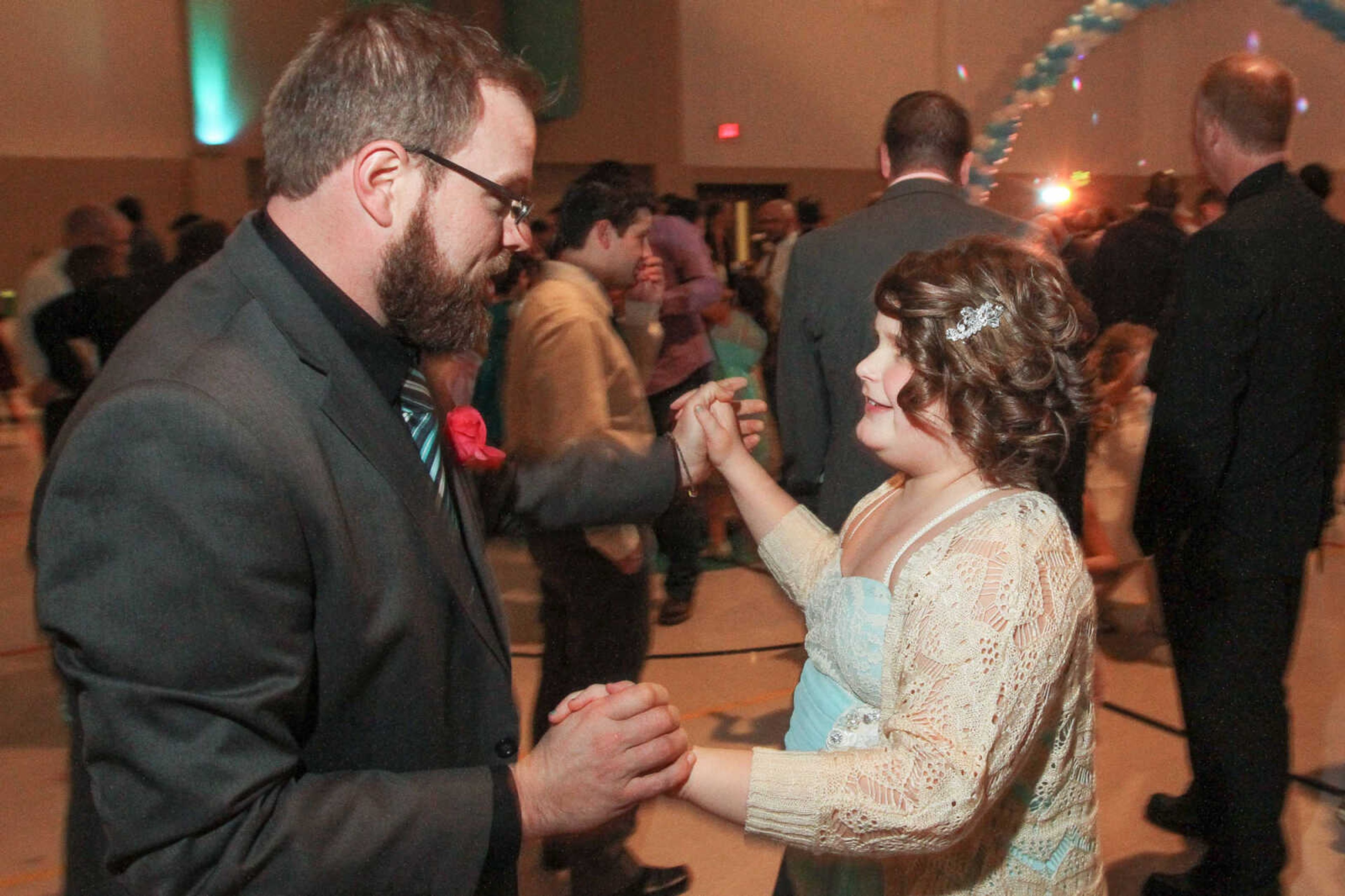 GLENN LANDBERG ~ glandberg@semissourian.com

Andy Helle shares a dance with his daughter Allie during the 7th annual Father/Daughter Dance Saturday, Feb. 21, 2015 at the Osage Centre.