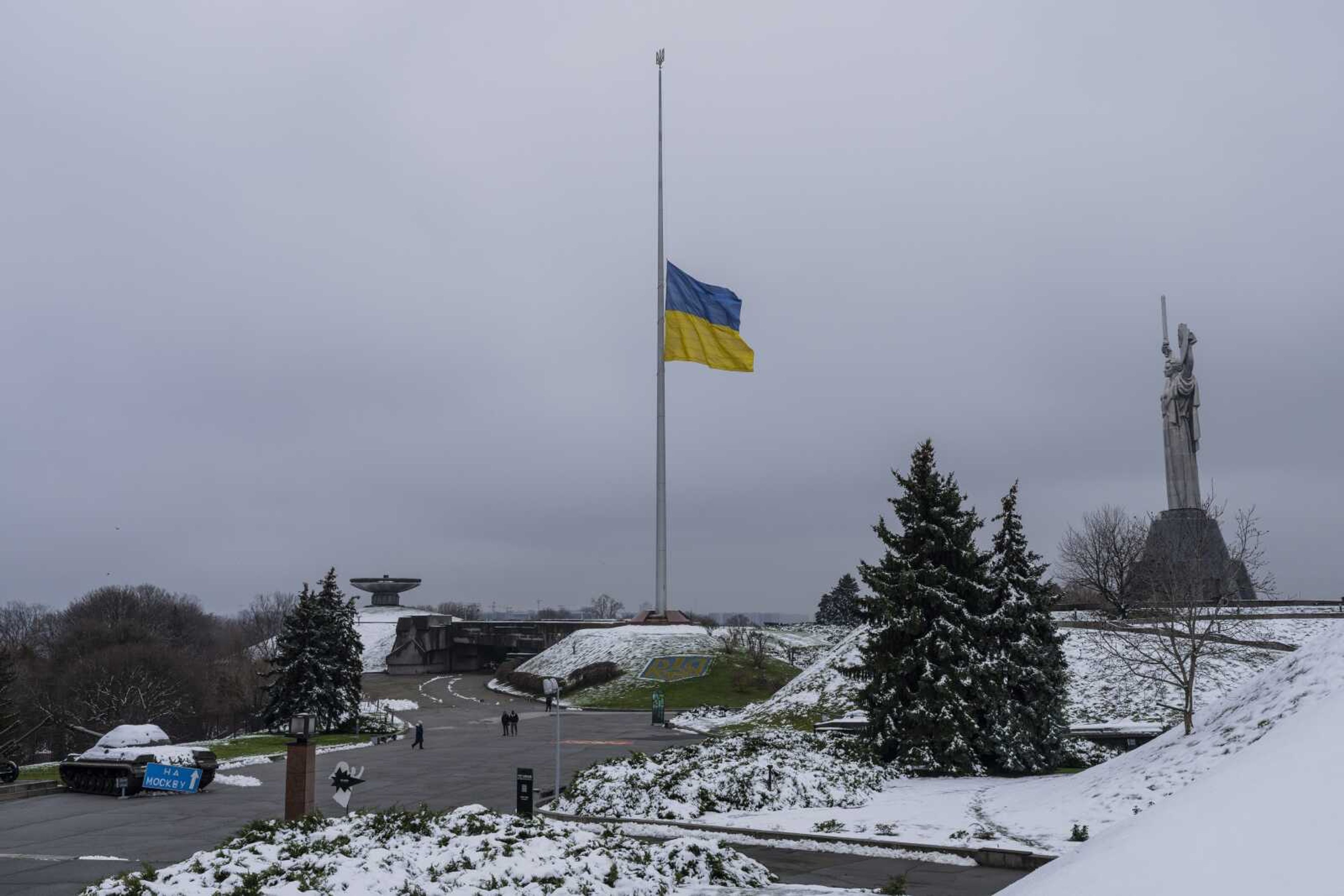 The Ukrainian flag flutters at half mast near the Ukrainian Motherland monument Tuesday, Nov. 29, in Kyiv, Ukraine.