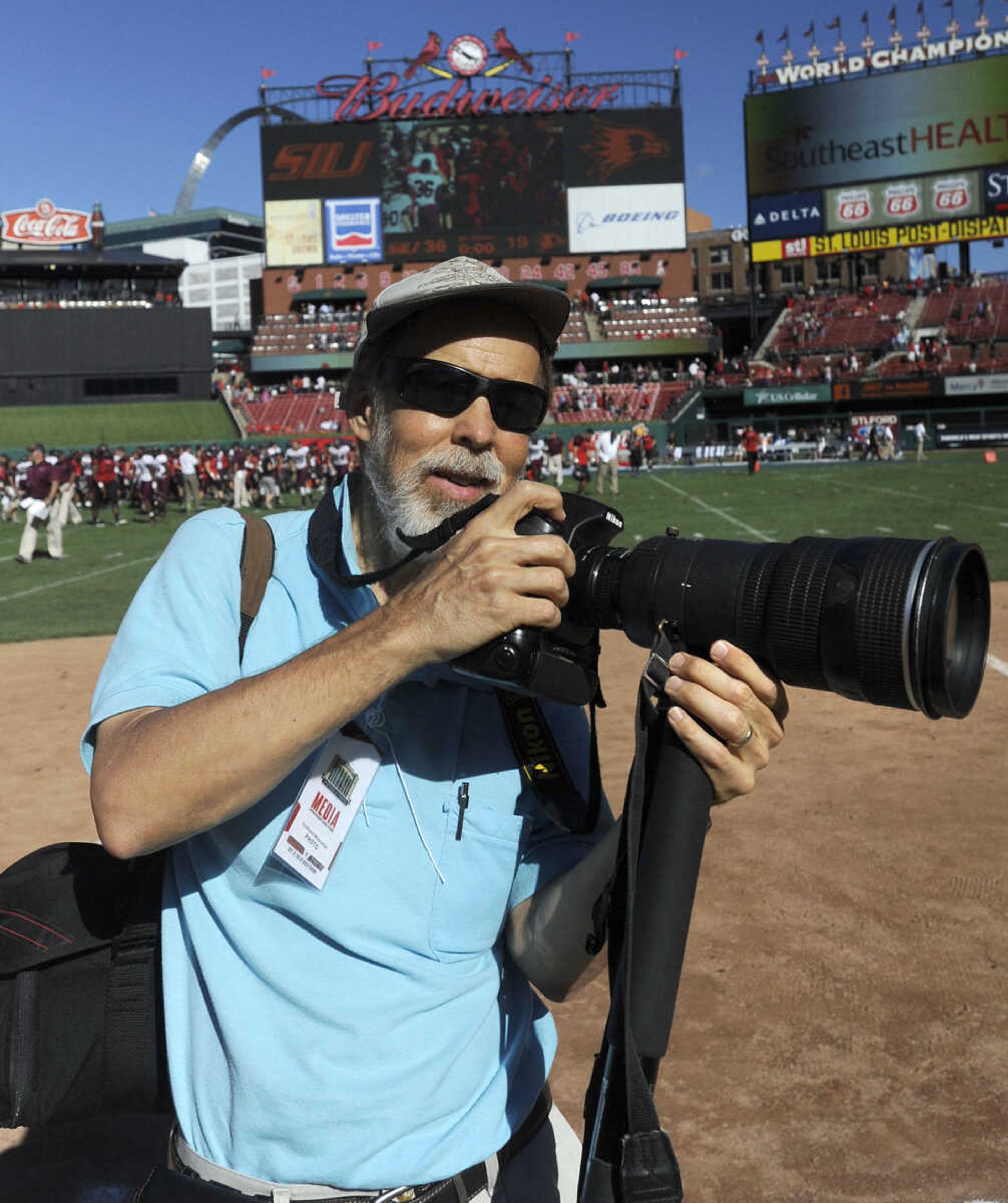 Southeast Missourian photographer Fred Lynch poses for a photo after covering the College Classic rivalry football game with Southeast Missouri State and Southern Illinois University-Carbondale on Sept. 21, 2013, at Busch Stadium in St. Louis. It was the first-ever football game held at Busch. SIU won 36-19. (Keith Hente)