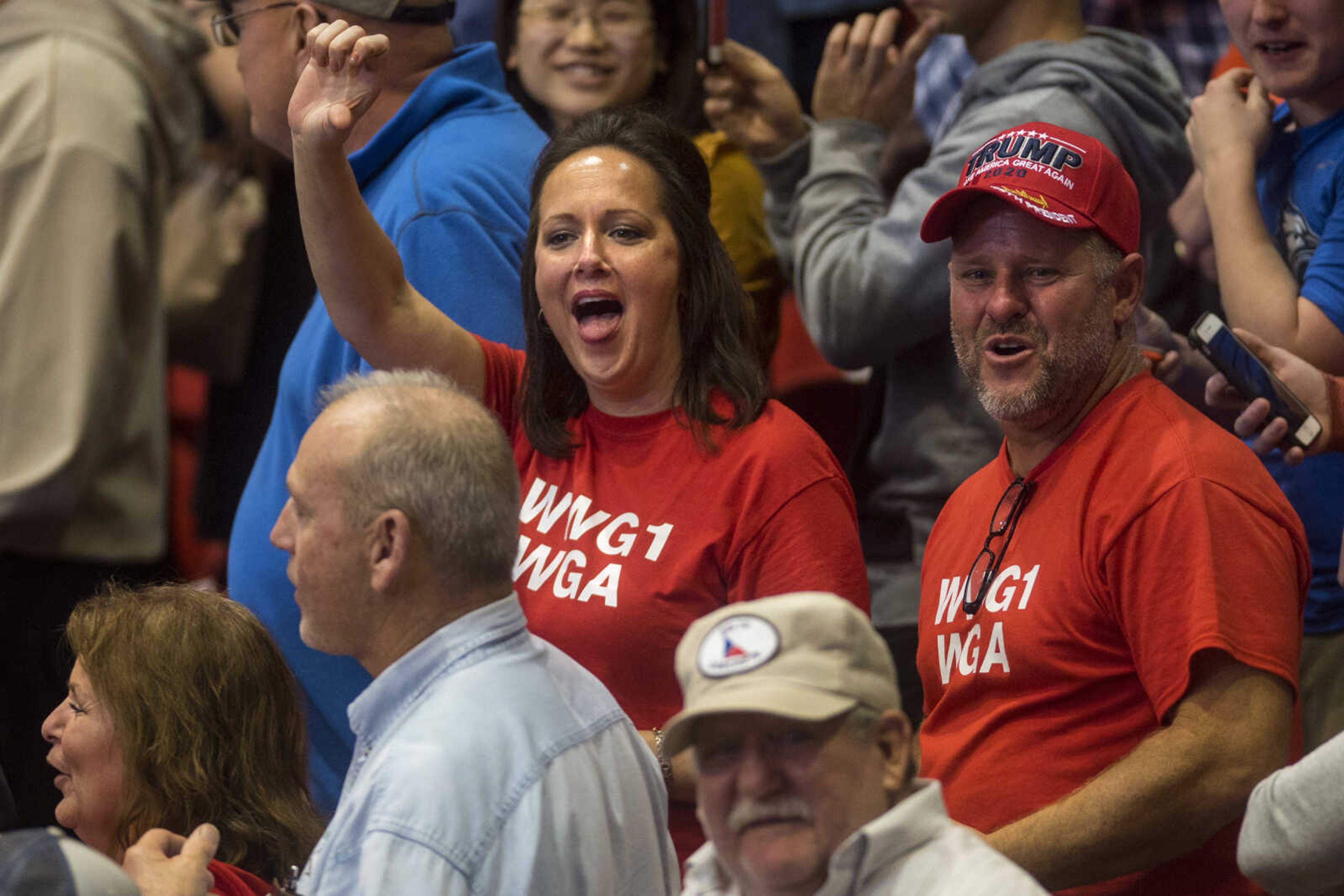 Members of the crowd boo the press at the Show Me Center during a rally for President Trump Monday.