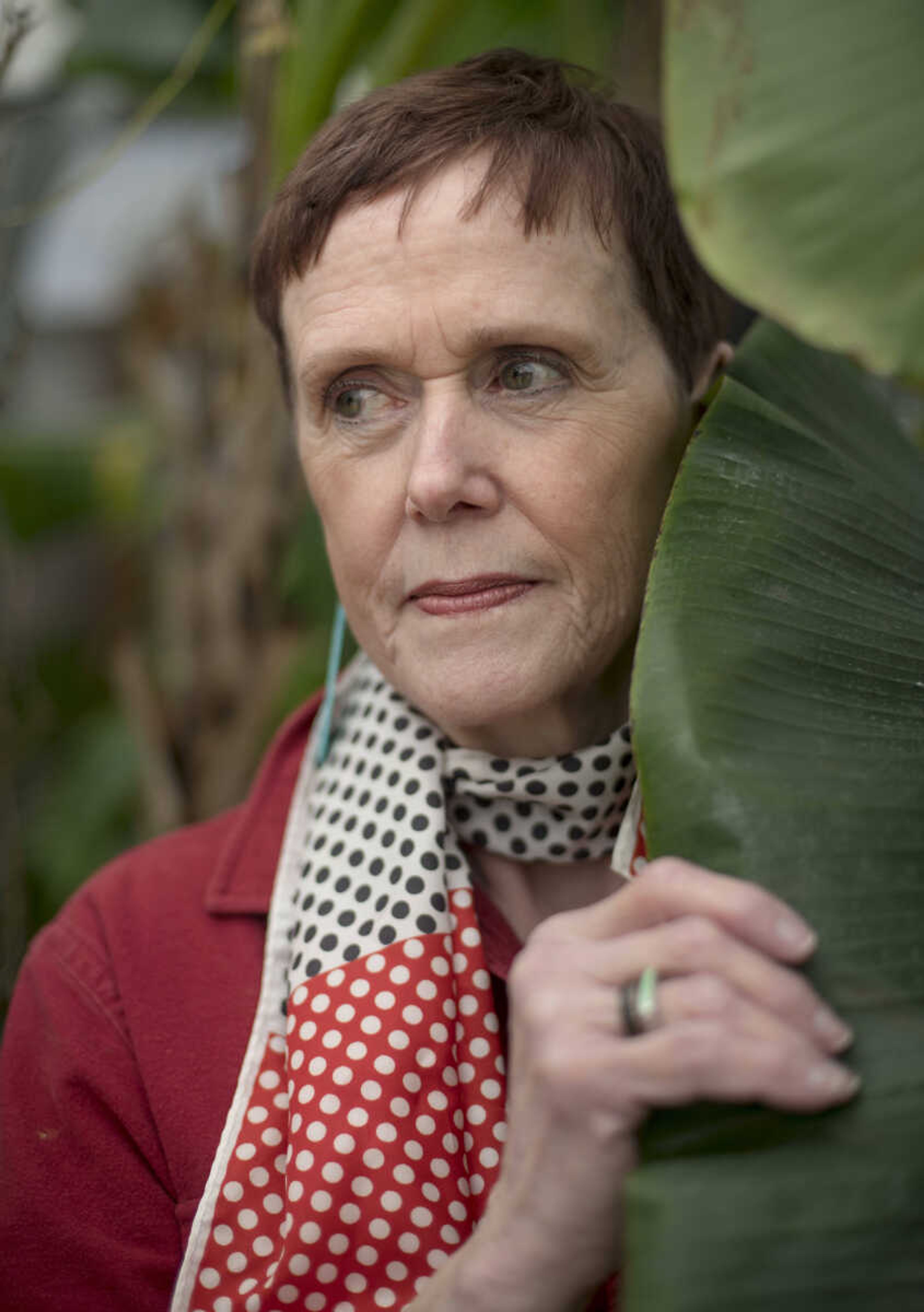 Caroline Thompson poses for a photo on Friday, Jan. 24, 2020, at Jim Hoffman's home greenhouse in Cape Girardeau.