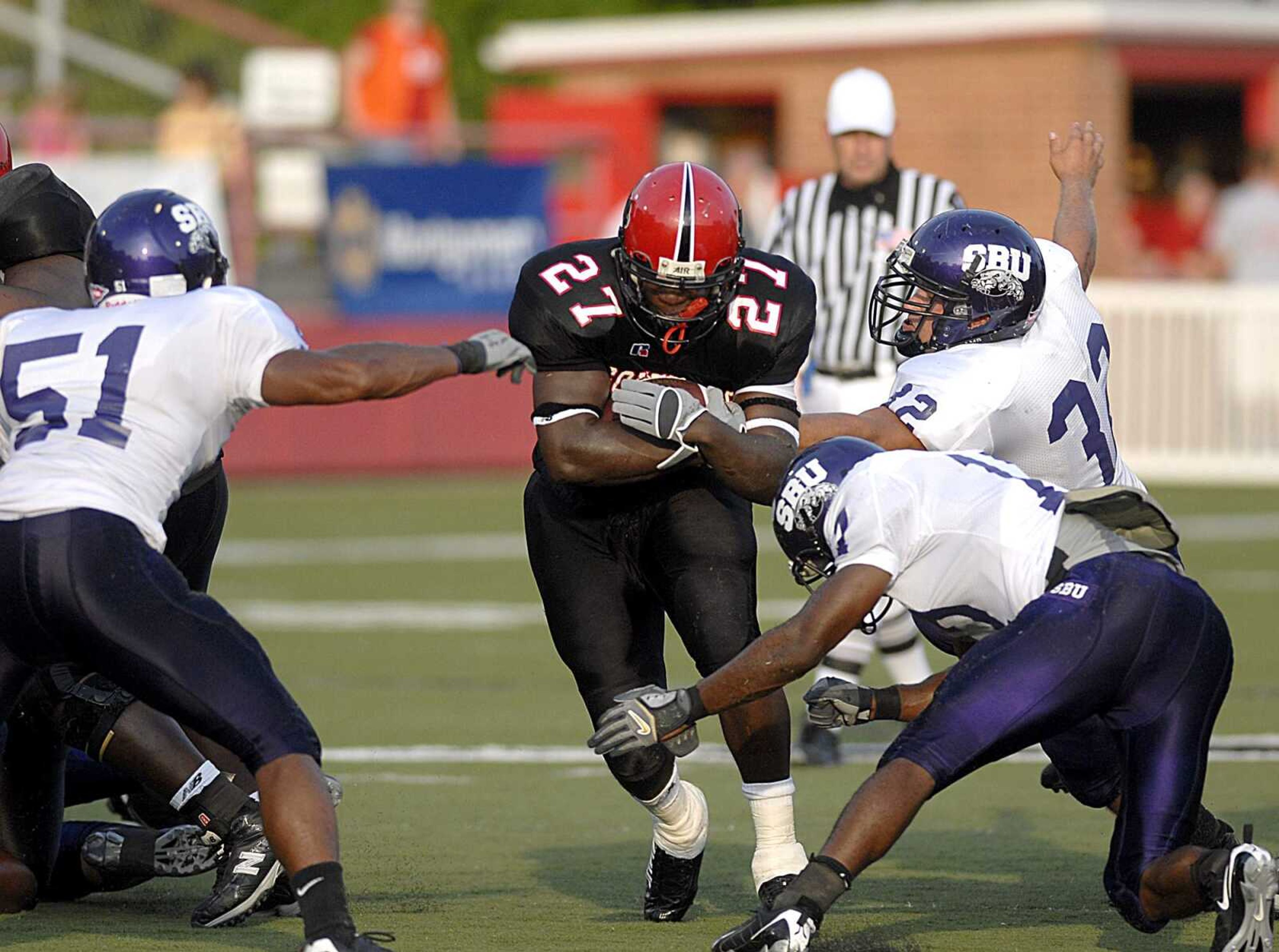 AARON EISEHAUER ~ aeisenhauer@semissourian.com
Southeast running back Robert Watley pushes up the middle of Southwest Baptist's defense.