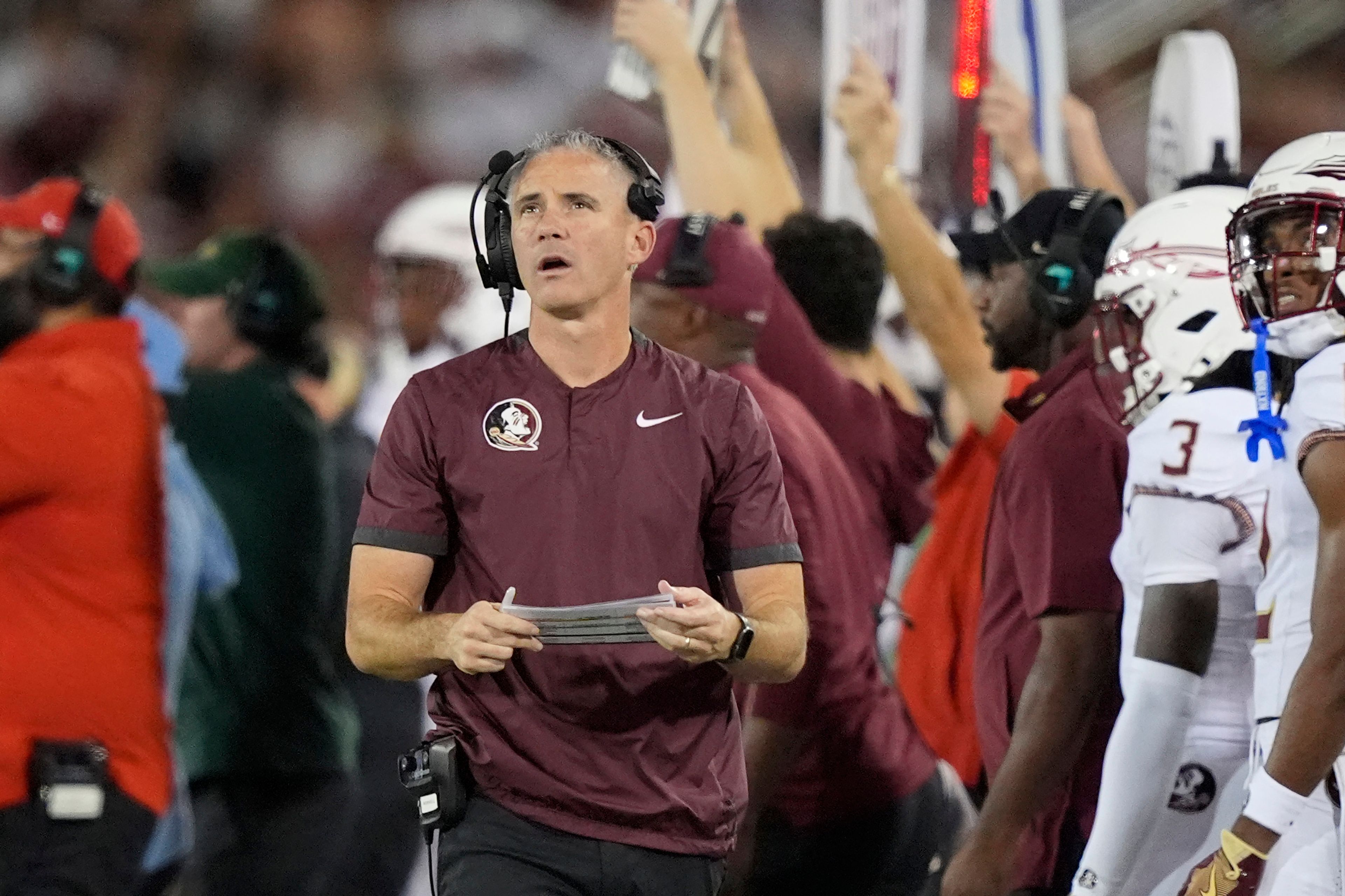 Florida State head coach Mike Norvell looks up from the sideline during the first half of an NCAA college football game against SMU, Saturday, Sept. 28, 2024, in Dallas. (AP Photo/LM Otero)