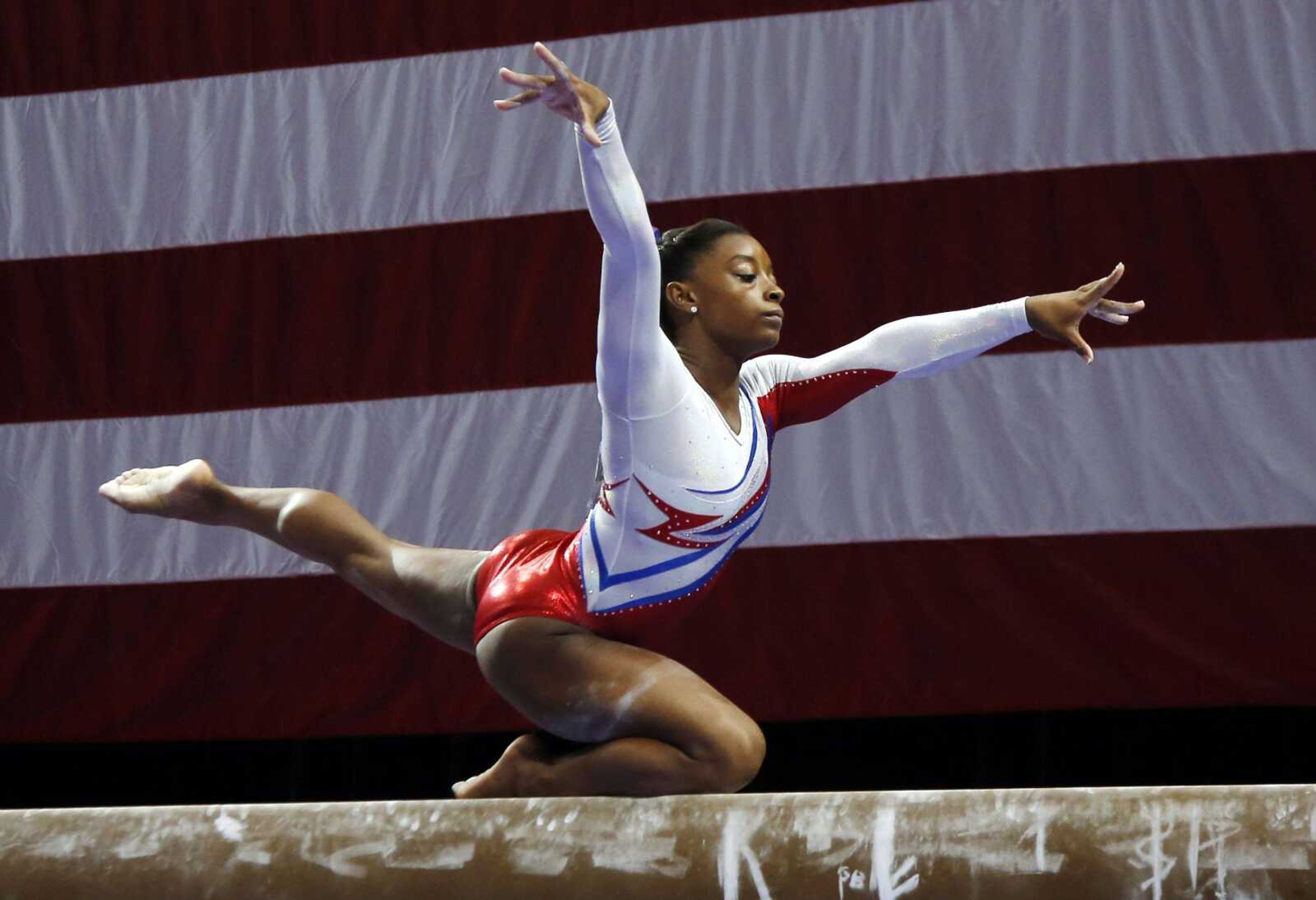 Simone Biles competes on the balance beam during the U.S. women&#8217;s gymnastics championships in Hartford, Conn., Saturday. (Elise Amendola ~ Associated Press)