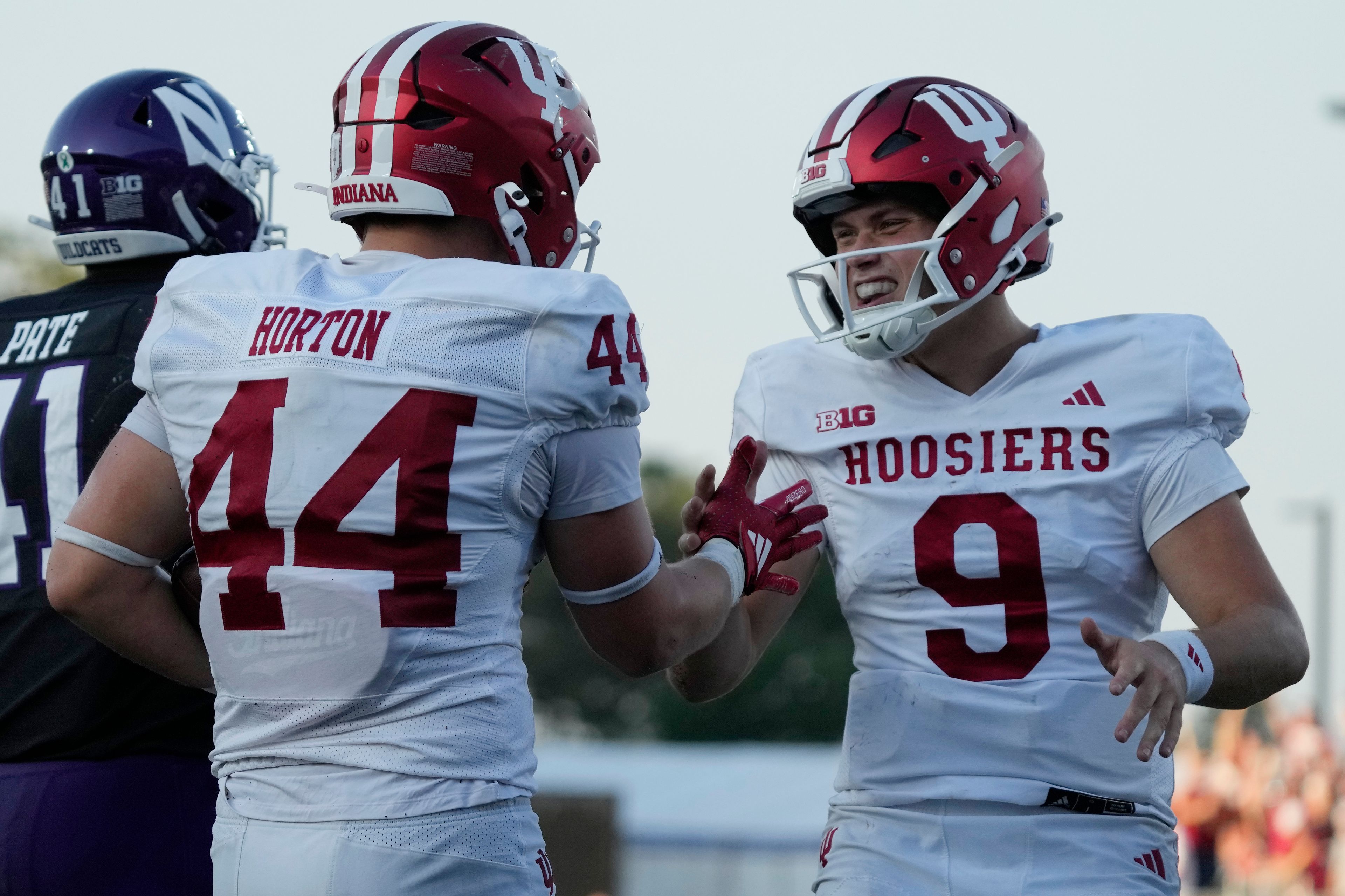 Indiana tight end Zach Horton, left, celebrates with quarterback Kurtis Rourke after scoring a touchdown during the second half of an NCAA college football game against Northwestern in Evanston, Ill., Saturday, Oct. 5, 2024. (AP Photo/Nam Y. Huh)