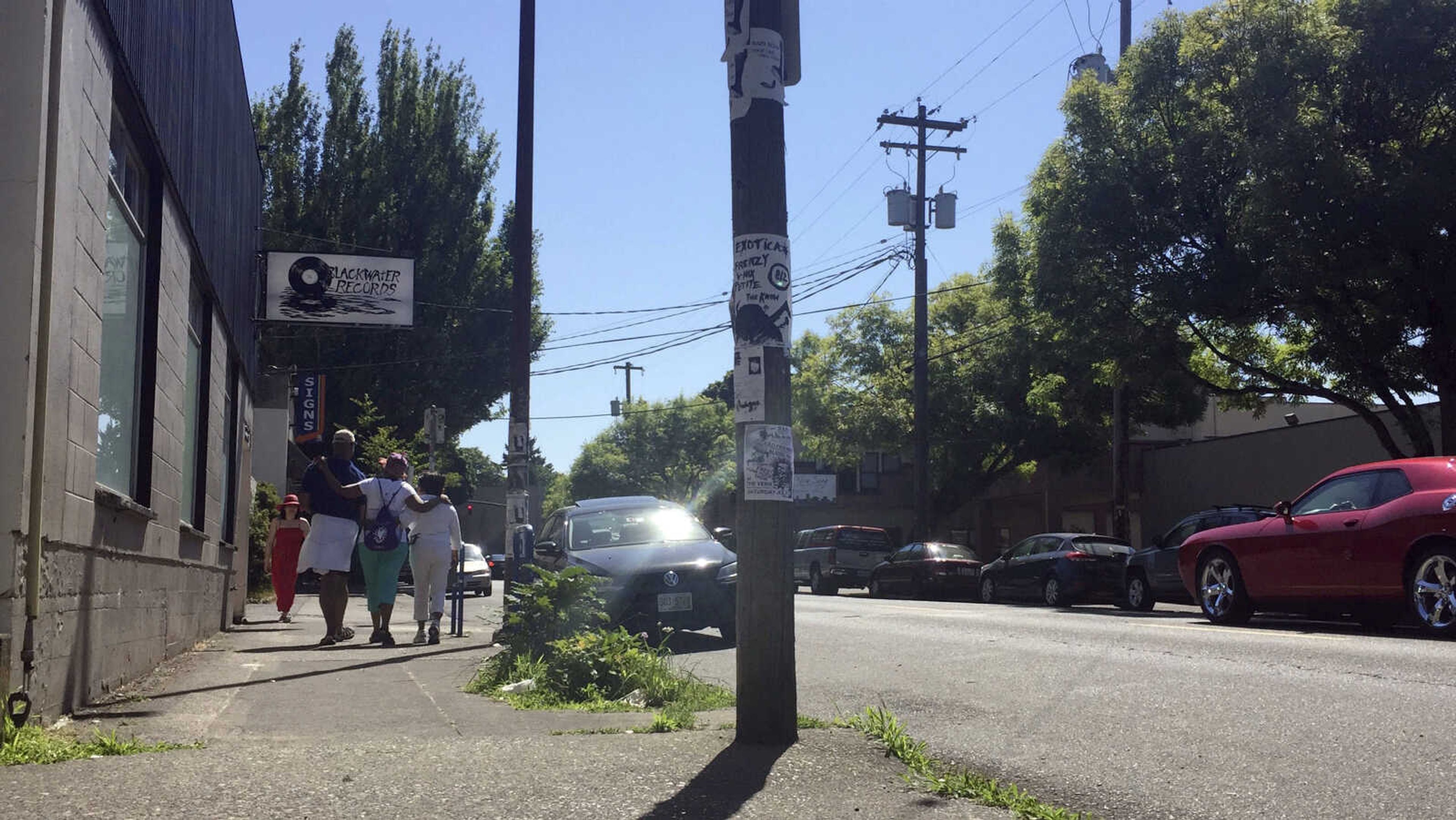 From left, Ron Young, Gahlena Easterly and Sharon Steen reminisce as they take a mile-long walk July 6 through North Portland, Oregon, streets that once were full of black-owned homes and businesses. Researchers are studying whether jogging memories where they were made can help African-American seniors stay sharp and slow early memory loss.