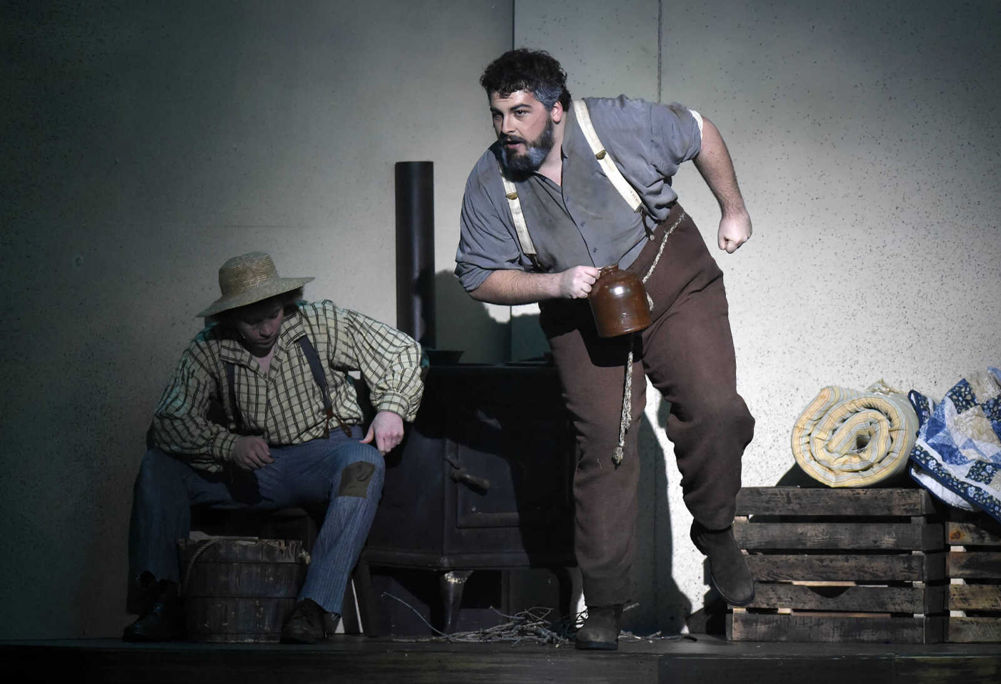 Pap Finn, played by Nicholas, grabs a jug of alcohol as Huckleberry Finn, played by Nicholas Kuchem, sits in the background during The Conservatory of Theatre and Dance's production of "Big River: The Adventures of Huckleberry Finn" on Wednesday, Feb. 22, 2017, at Southeast Missouri State University's River Campus. The show runs through Sunday.