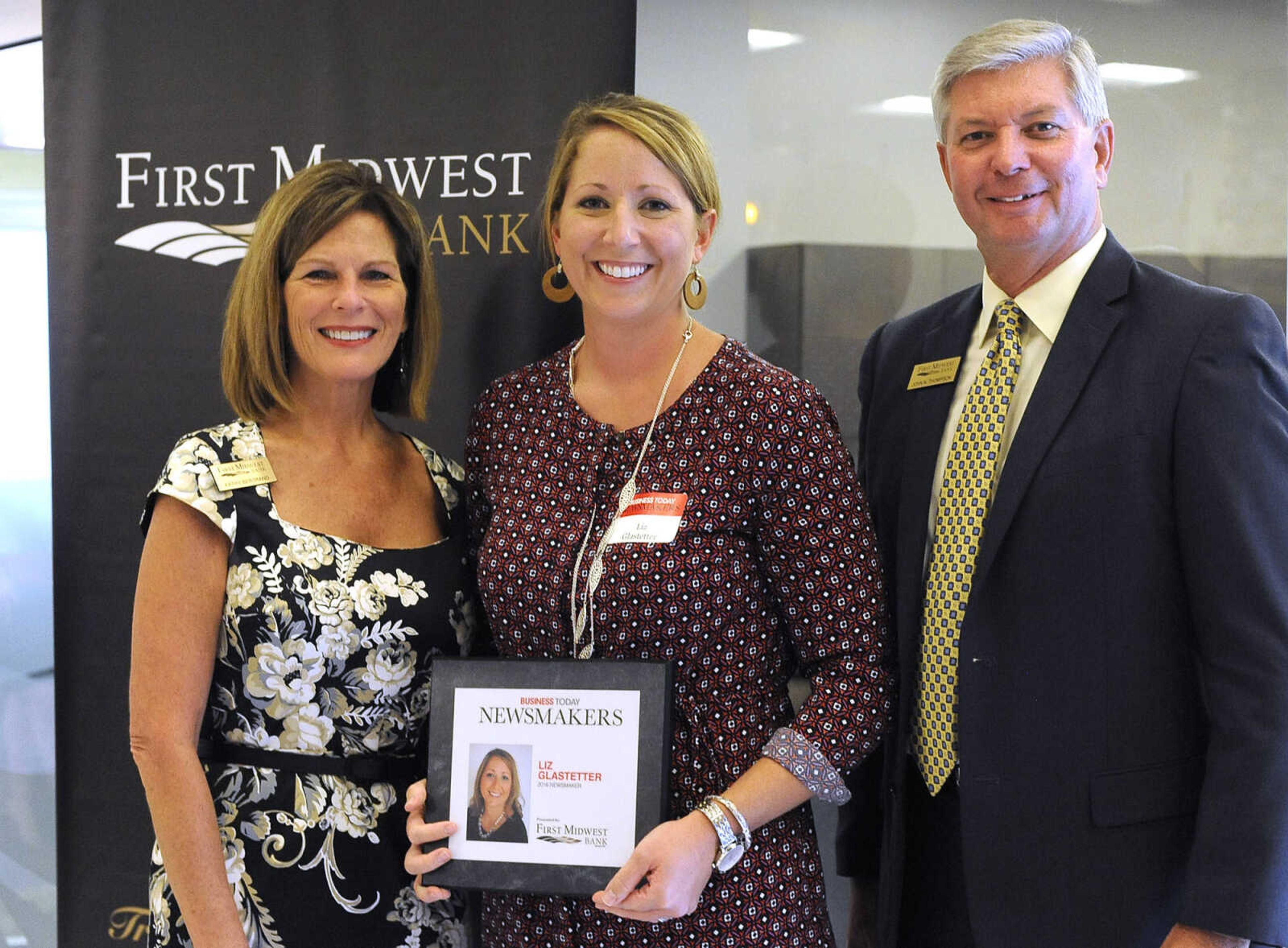 Liz Glastetter poses for a photo with Kathy Bertrand, First Midwest Bank community bank president, Cape Girardeau, and John N. Thompson, First Midwest Bank community bank president, Jackson, Wednesday, Sept. 7, 2016 during the Business Today Newsmakers awards reception at First Midwest Bank in Cape Girardeau.