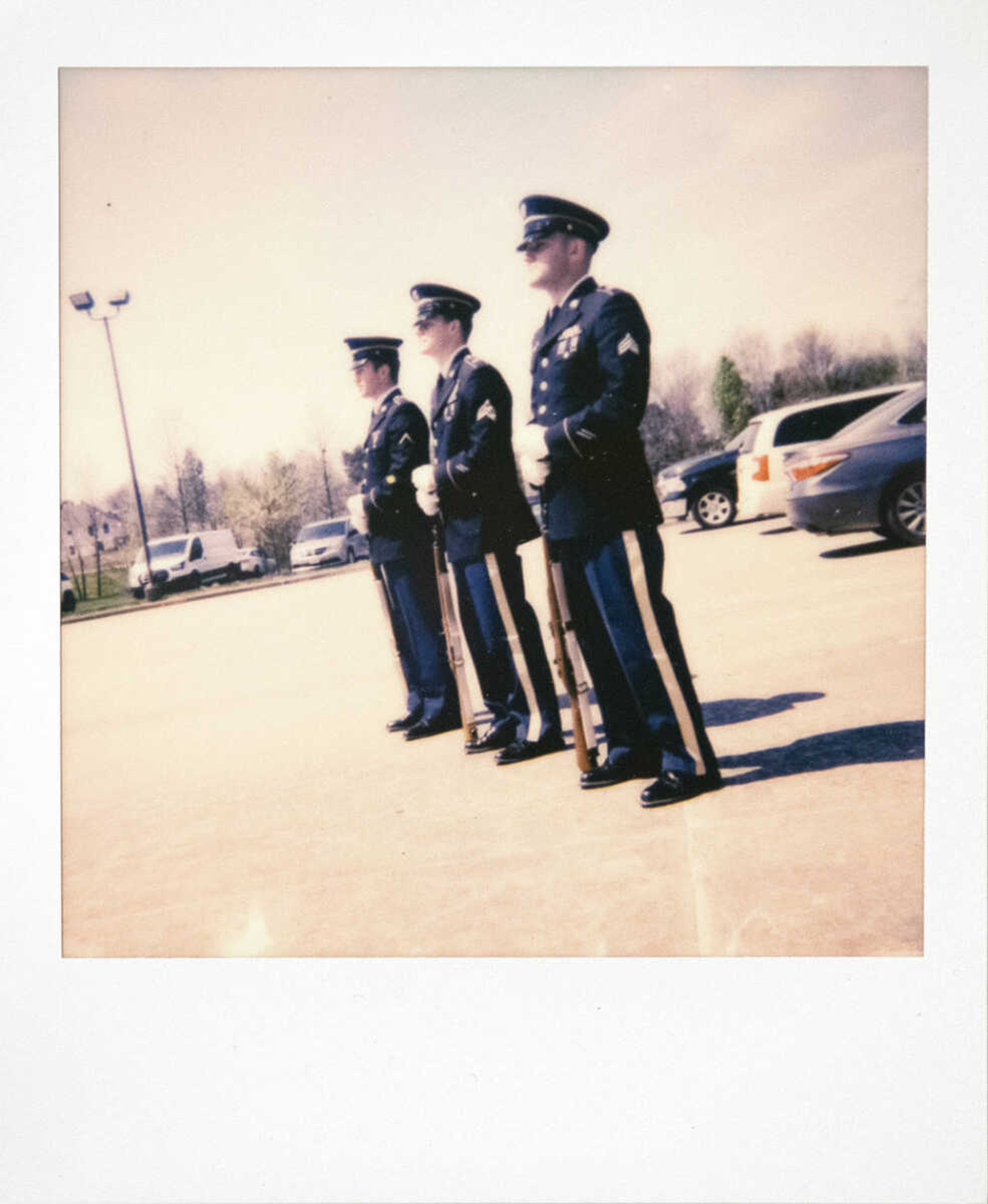 Members of the Missouri Army National Guard, from left, Conner Wakeland of St. Louis, Missouri, Kody Roy of Cape Girardeau and Dylan Hovis of Bloomfield, Missouri, stand while performing military honors for the late World War II veteran Clifford Heinrich of Cape Girardeau on Wednesday, April 1, 2020, at Ford & Sons Funeral Home in Cape Girardeau. Missouri Army National Guard Sgt. 1st Class Justin Bickings of Cape Girardeau said state veterans cemeteries are still having burials, but aren't having services at the cemeteries. Following the honors, Heinrich was schedule to be buried at the Missouri Veterans Cemetery in Bloomfield.