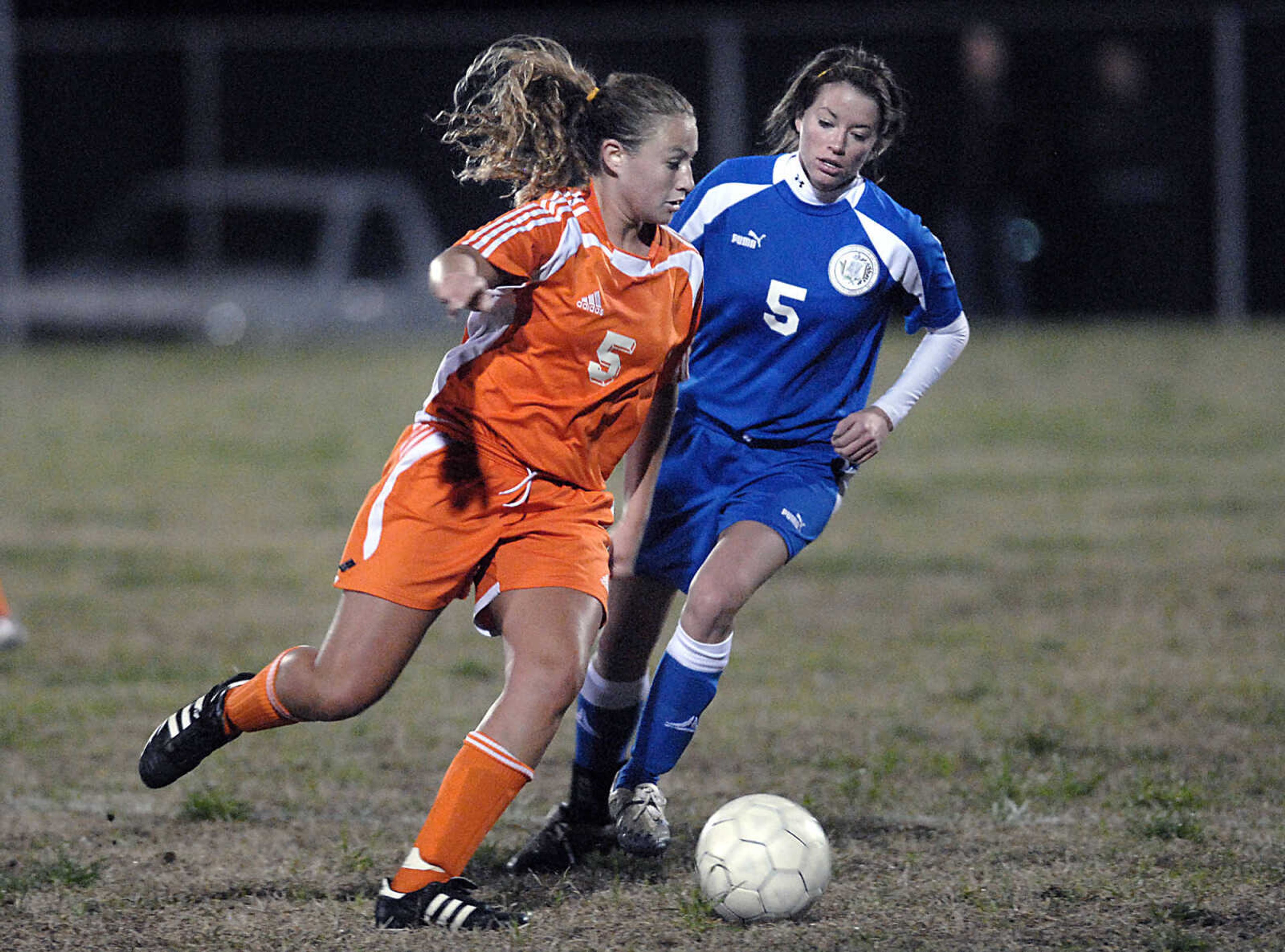 KIT DOYLE ~ kdoyle@semissourian.com
Central's Sarah Uptmor keeps the ball away from Mindy Seibert Wednesday, April 15, 2009, in Cape Girardeau.  The Bulldogs beat the Tigers 8-1.