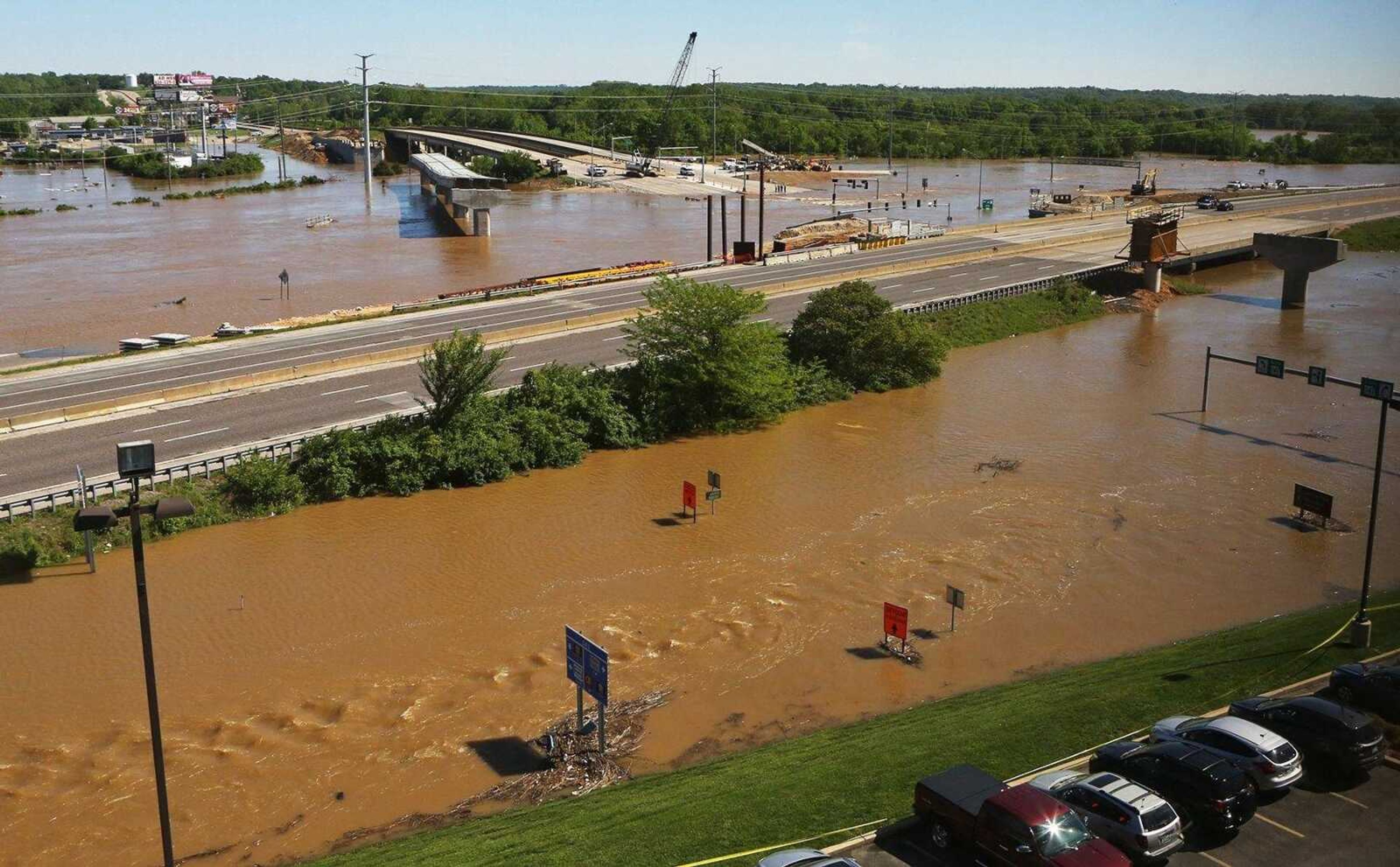 Waters flood the intersection of Interstate 44 and Highway 141 on Tuesday in this view from the top floor of the Drury Inn in Valley Park, Missouri. The flooded Meramec River has shut down all traffic at the intersection.