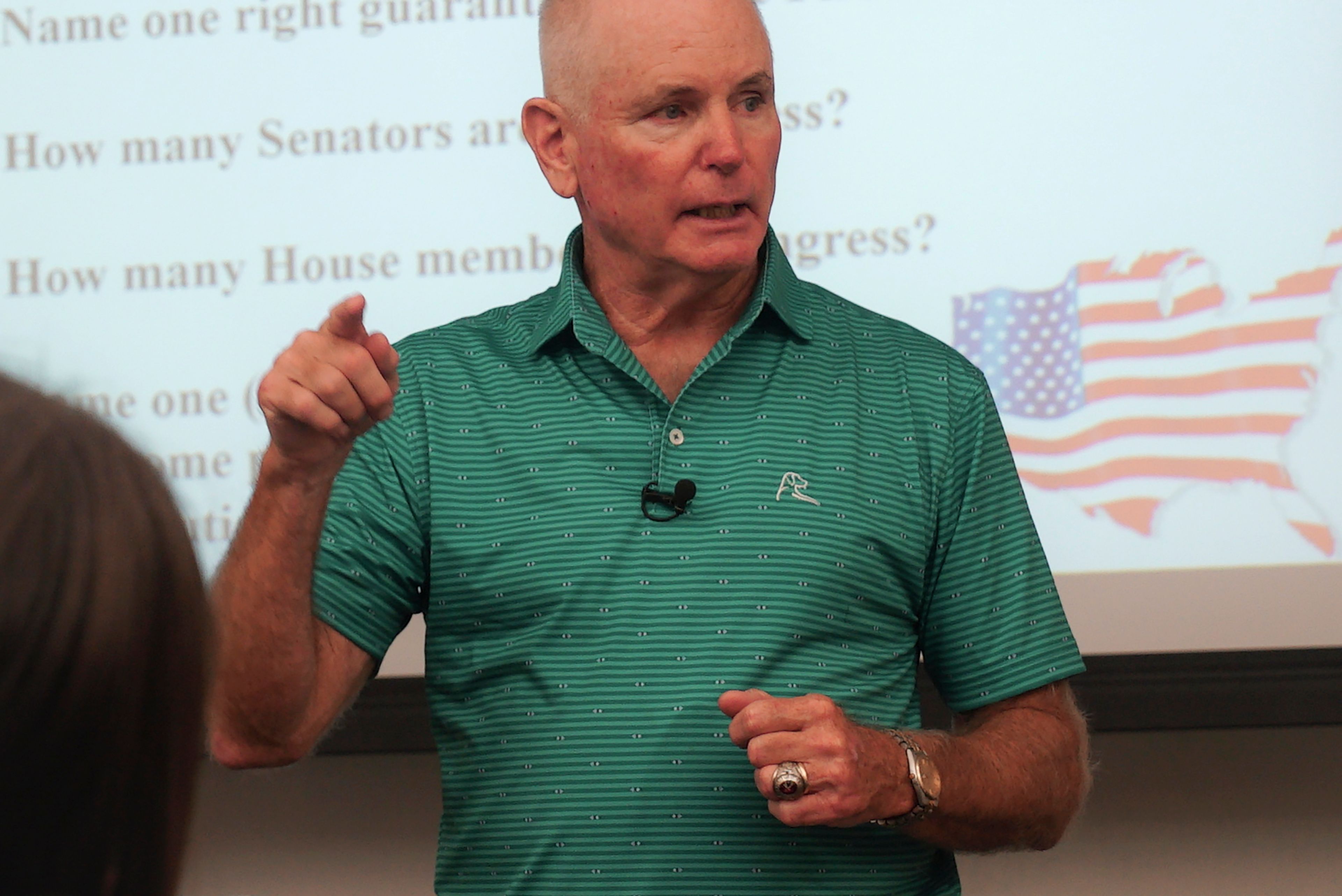 Professor Kevin Dopf lectures his American government students at the University of South Carolina Beaufort in Bluffton, S.C., on Tuesday, Aug. 20, 2024. The retired Arny lieutenant colonel always surprises his students on the first day with a citizenship test, and most of his students flunk. (AP Photo/Allen G. Breed)