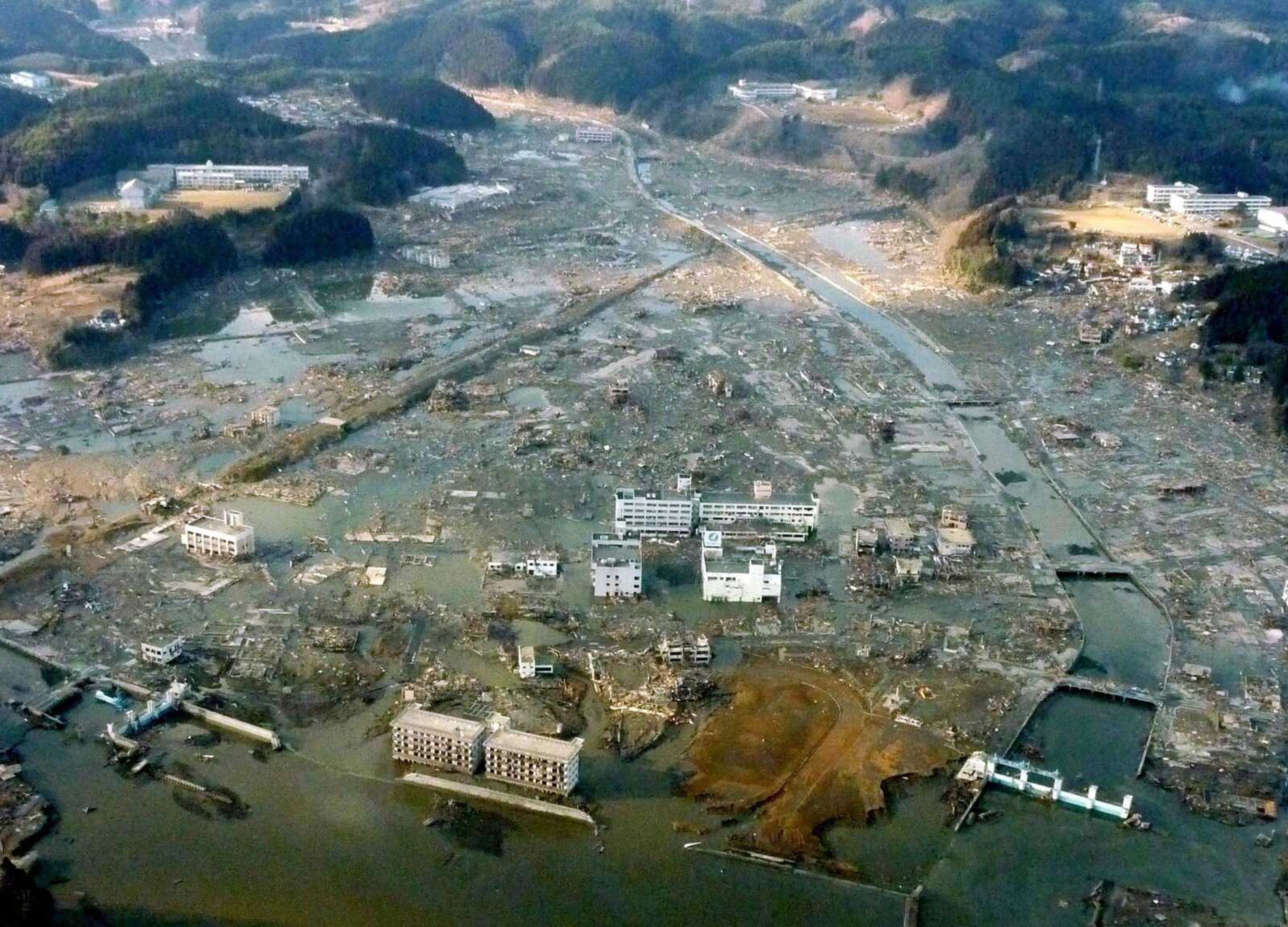 Minamisanriku in northern Japan remains submerged Saturday after Friday's earthquake-triggered tsunami. (Kyodo News)