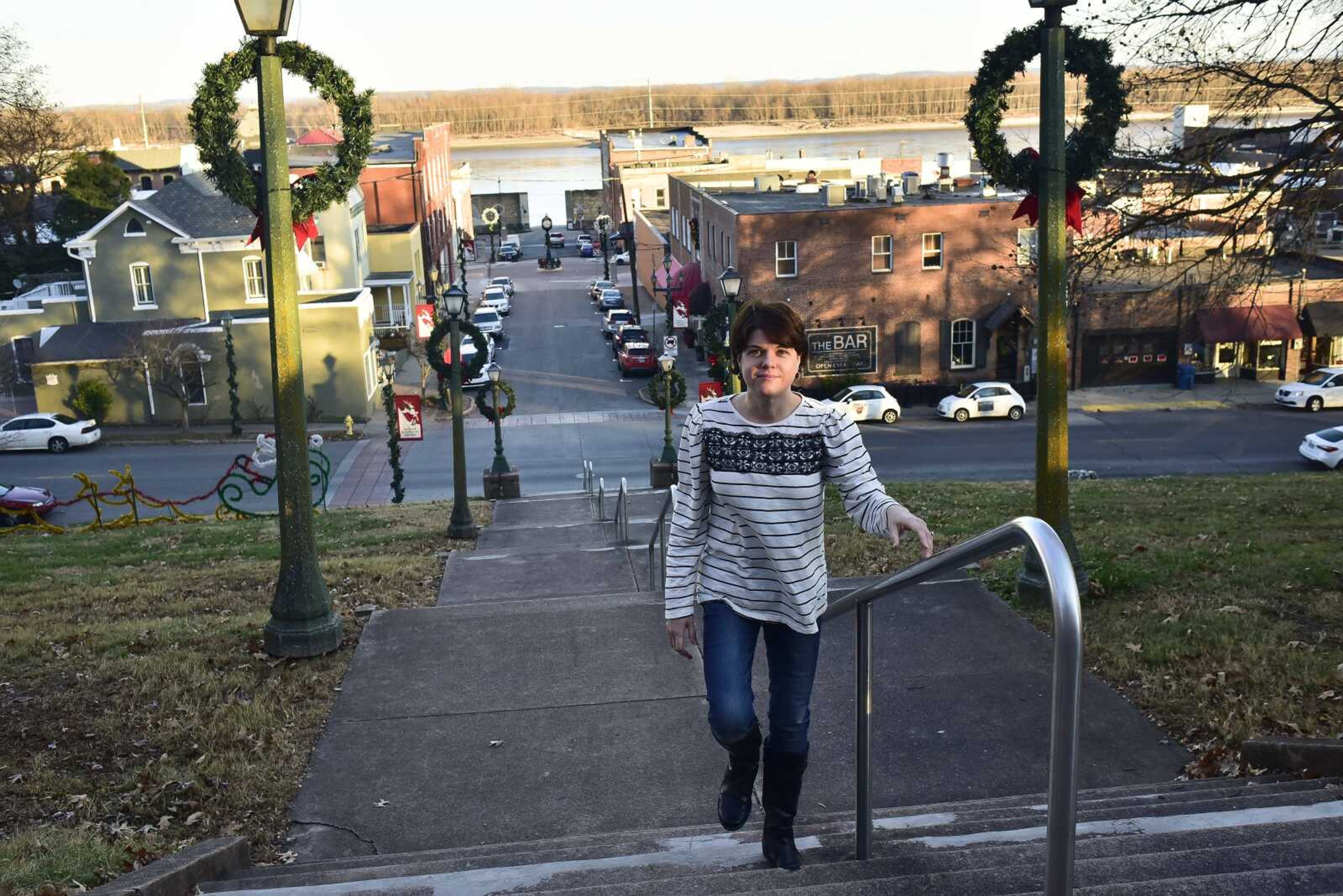 Amy Essner poses for a photo on the staircase at the Cape Girardeau Court of Common Pleas Wednesday, Dec. 20, 2017 in Cape Girardeau. Amy made a resolution in 2017 and stuck to it to lose weight. She lost 117 pounds.