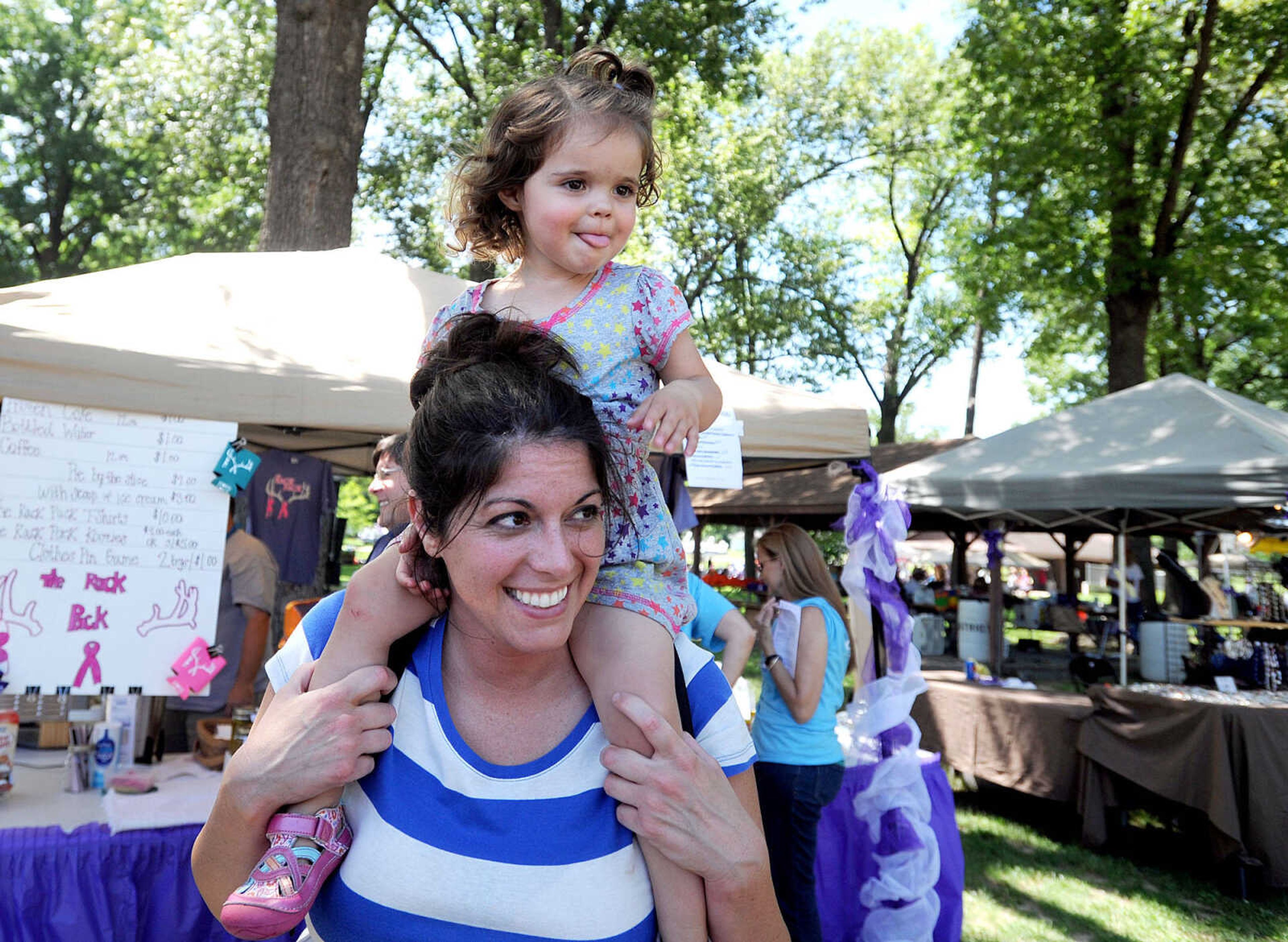 LAURA SIMON ~ lsimon@semissourian.com

Taylor Buccheit catches a lift from Laura Buccheit, Saturday, June 14, 2014, during the Relay for Life of Cape Girardeau County fundraiser at Arena Park.