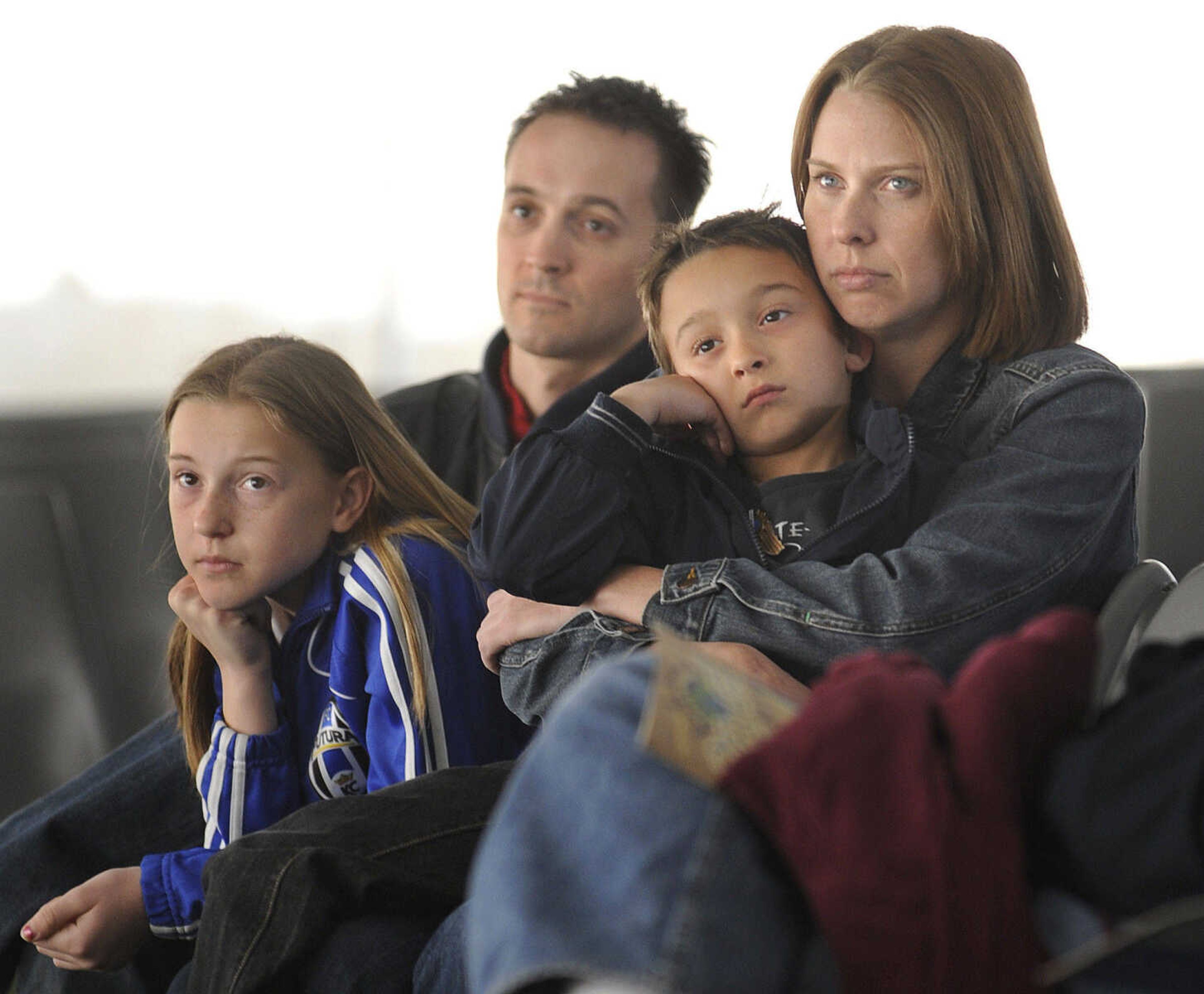 FRED LYNCH ~ flynch@semissourian.com
Darik and Iva Metge with their children, Olivia, left, and Simon of Warrensburg, Mo., listen to storyteller Priscilla Howe Friday at the Cape Girardeau Storytelling Festival.