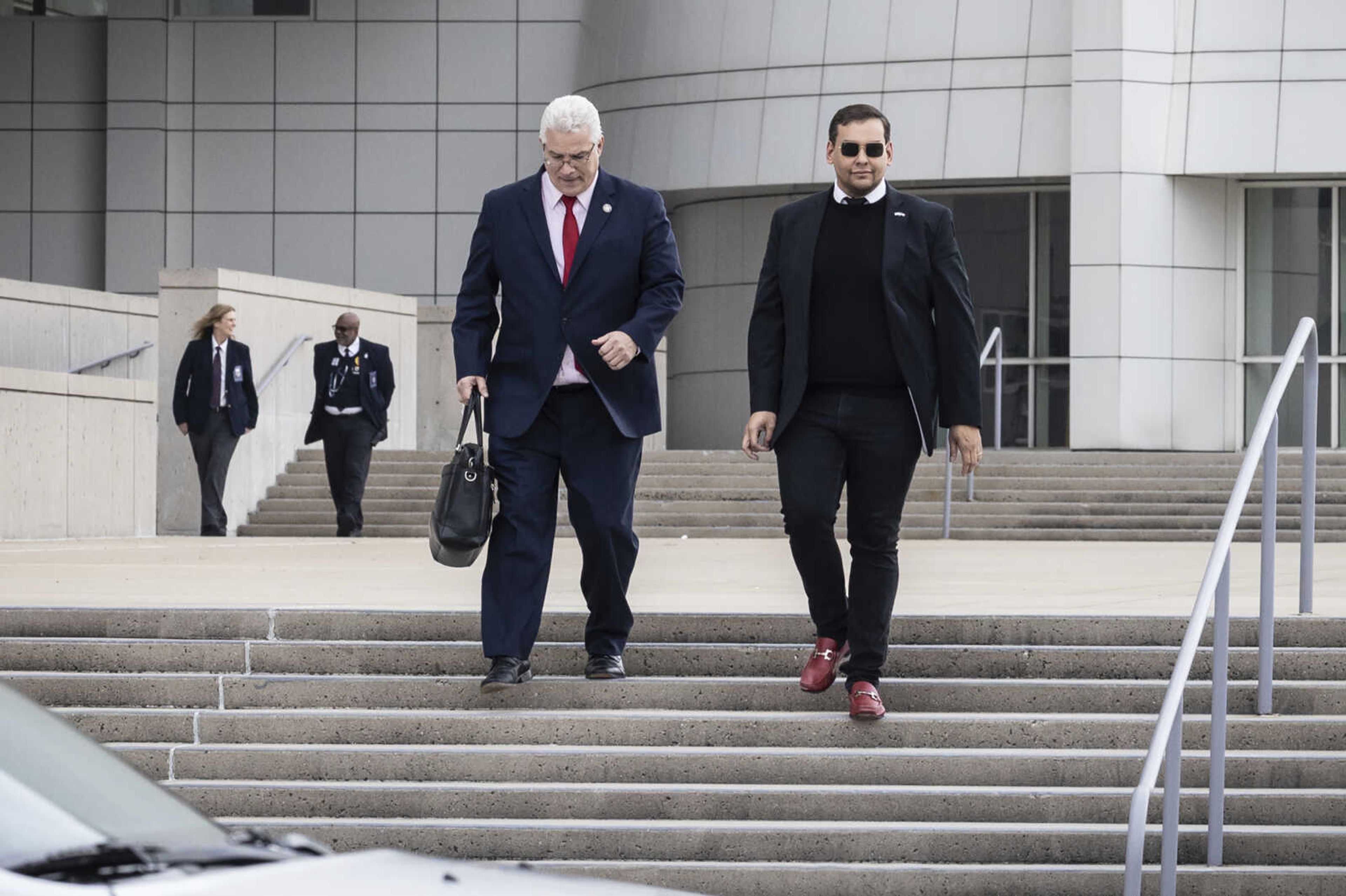 U.S. Rep. George Santos leaves the federal courthouse in Central Islip, N.Y.,  on Friday Oct. 27, 2023. Santos has pleaded not guilty to on a revised indictment accusing him of several frauds, including making tens of thousands of dollars in unauthorized charges on credit cards belonging to his campaign donors.  (AP Photo/Stefan Jeremiah)