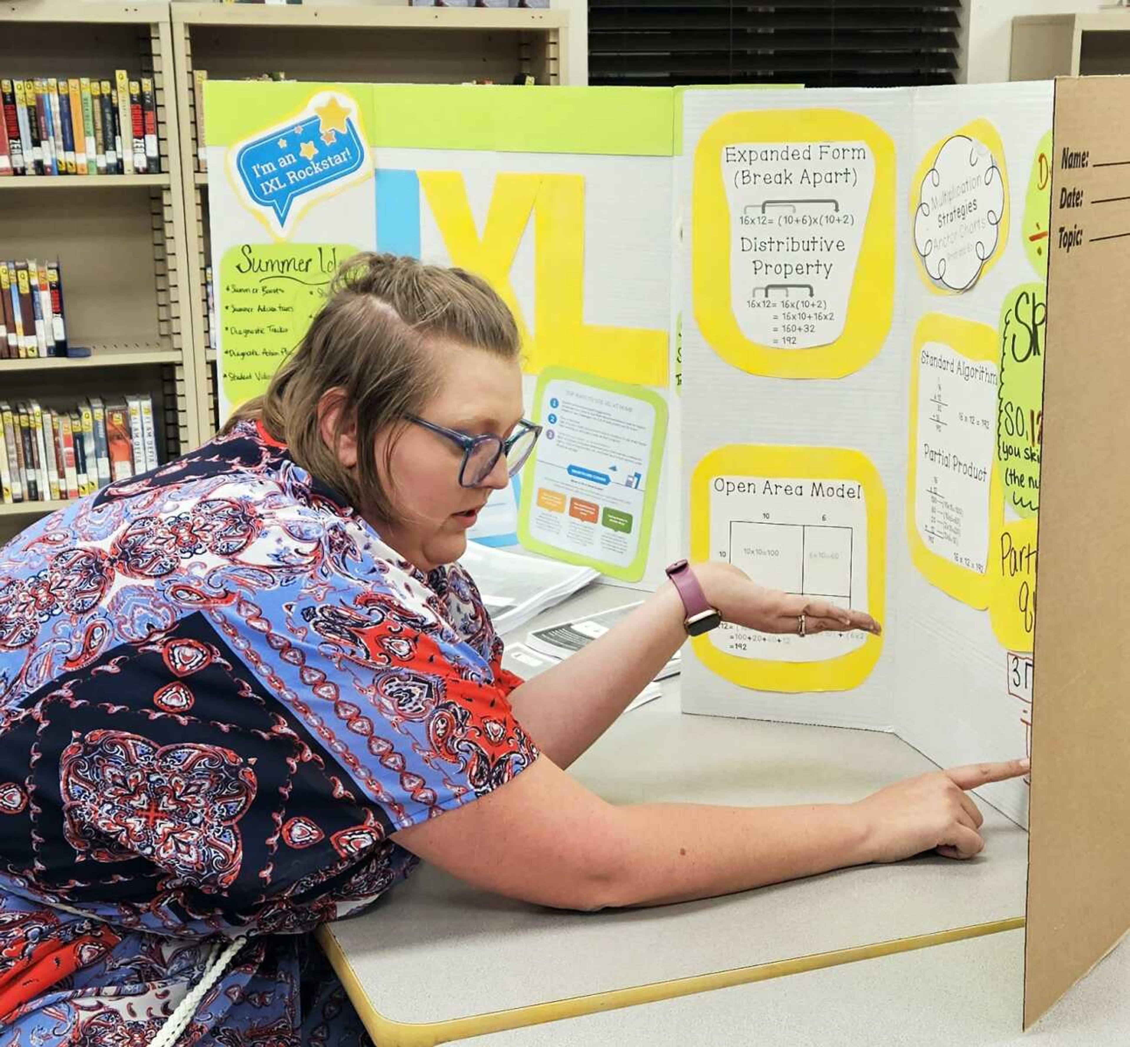 Fourth-grade teacher Kayla White explains a new program, IXL, used at school.