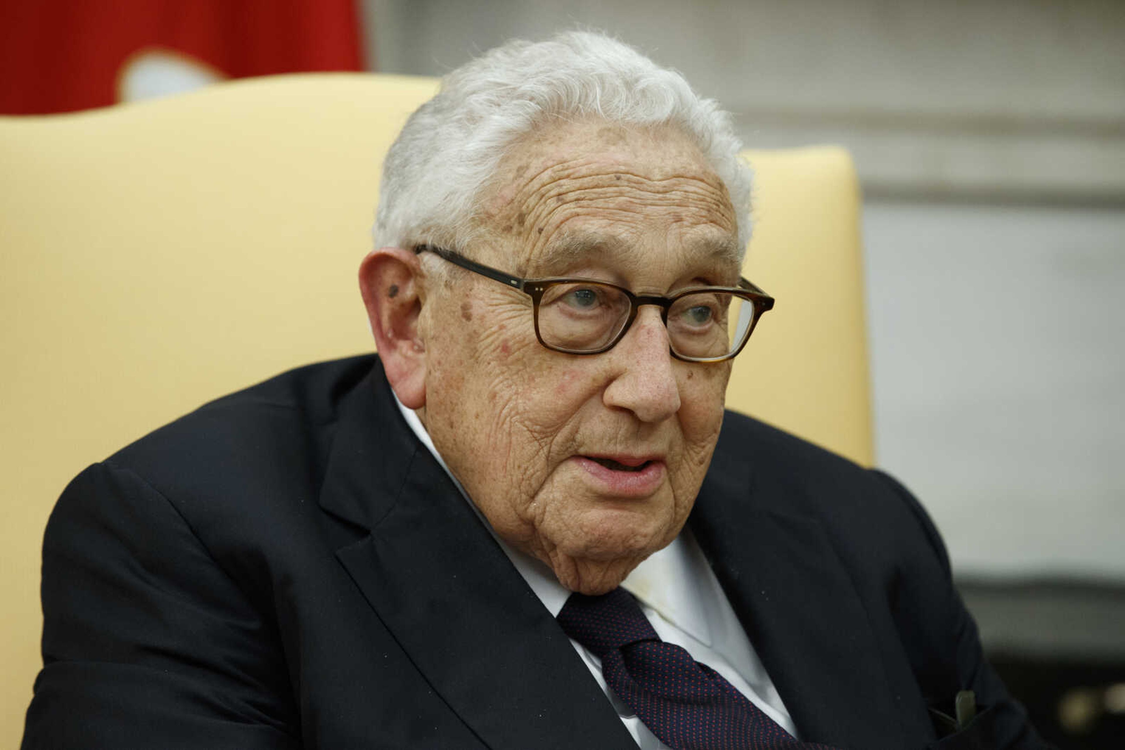 Former Secretary of State Henry Kissinger speaks during a meeting with President Donald Trump in the Oval Office of the White House on Oct. 10, 2017, in Washington.