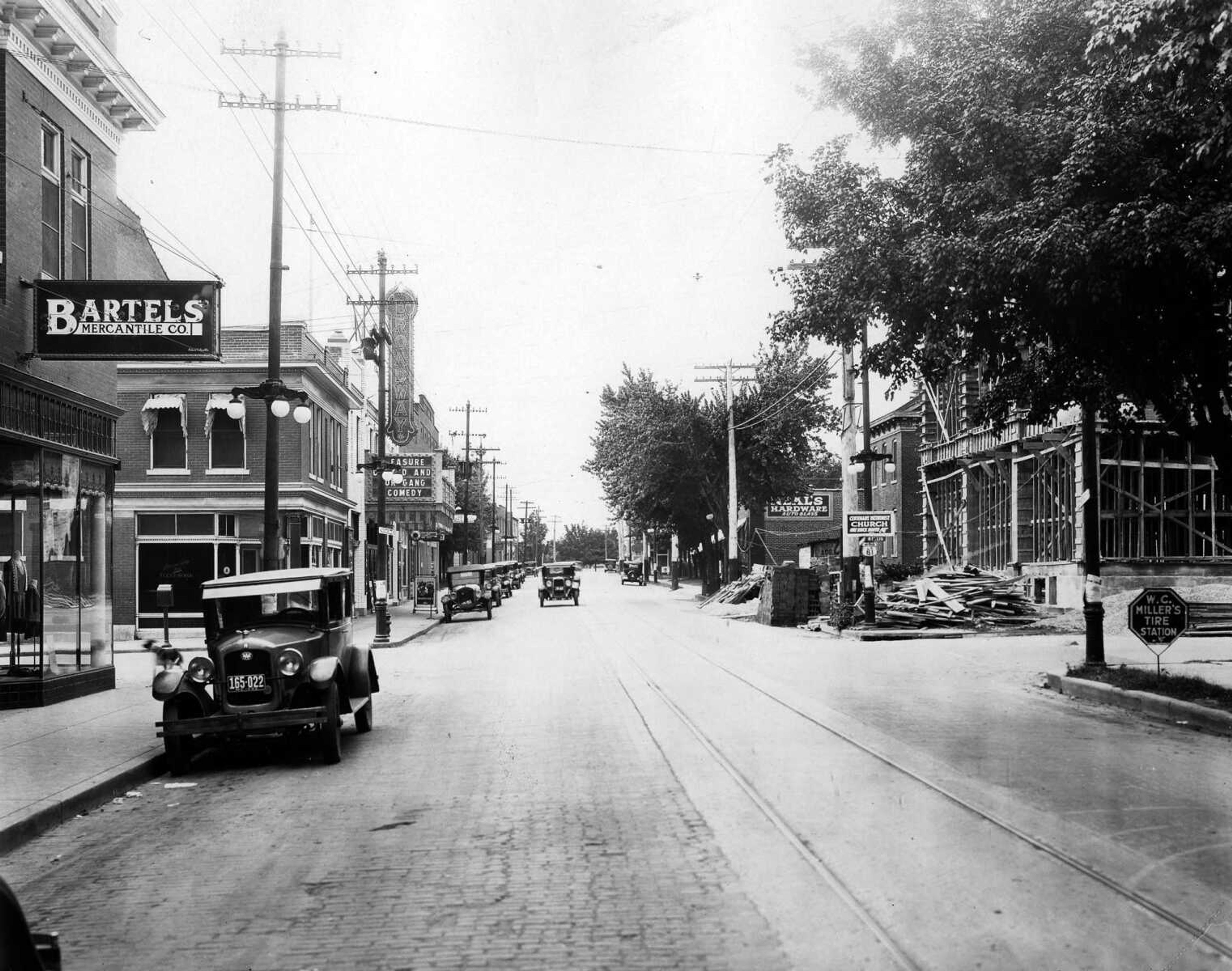 Looking west along Broadway at Ellis Street, the Bartels Mercantile Co. store is at left. Crossing Ellis were the telephone company and the Broadway Theater. At the northwest corner of Broadway and Ellis, the new telephone company building was under construction. (Published Oct. 3, 1929, Missourian's 25th anniversary edition)