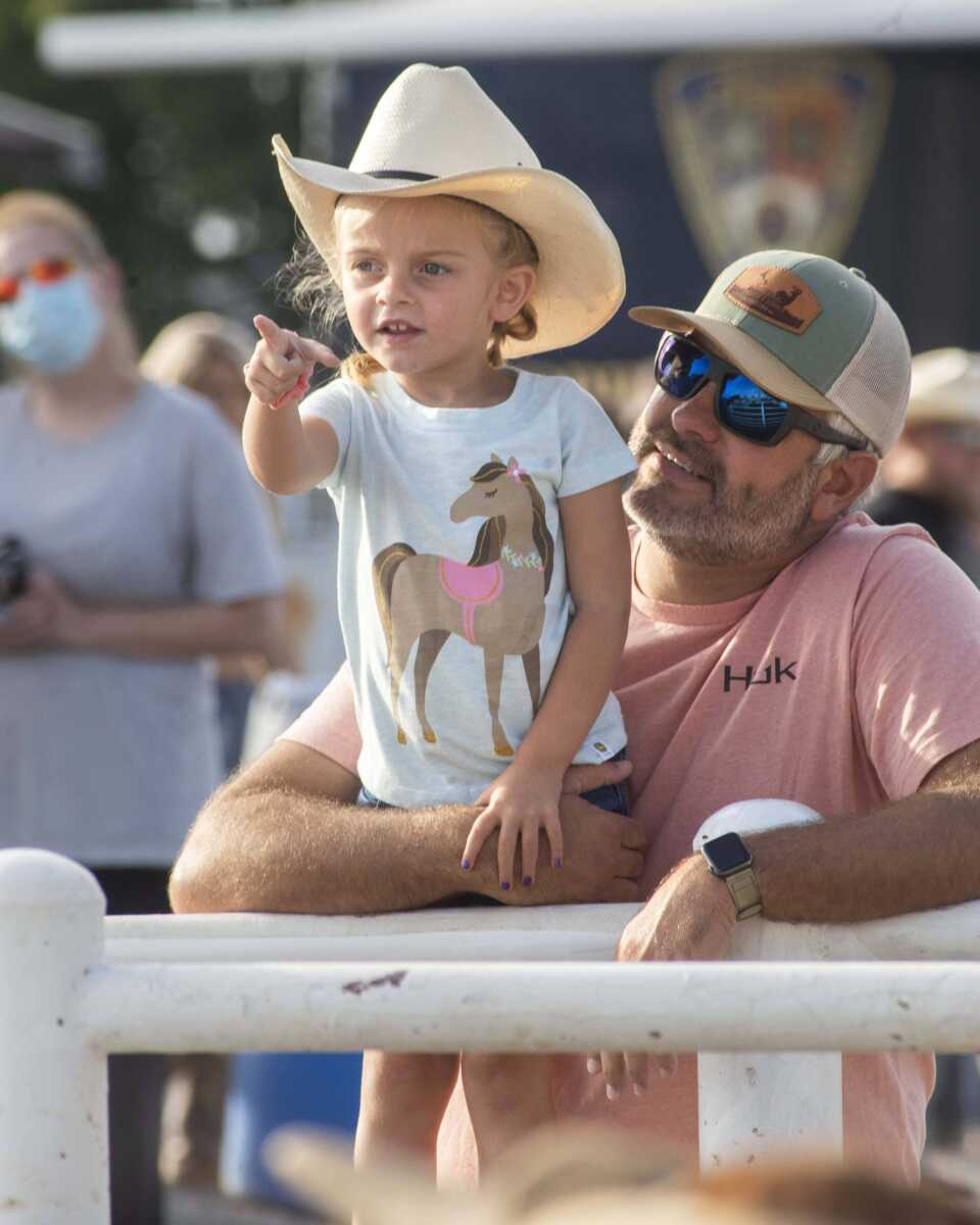 Four-year-old Emerson Simons points out the horns on penned livestock to her father, Tyler, during the last night of the Sikeston Jaycee Bootheel Rodeo Saturday, Aug. 14, 2021,&nbsp;in Sikeston, Missouri.