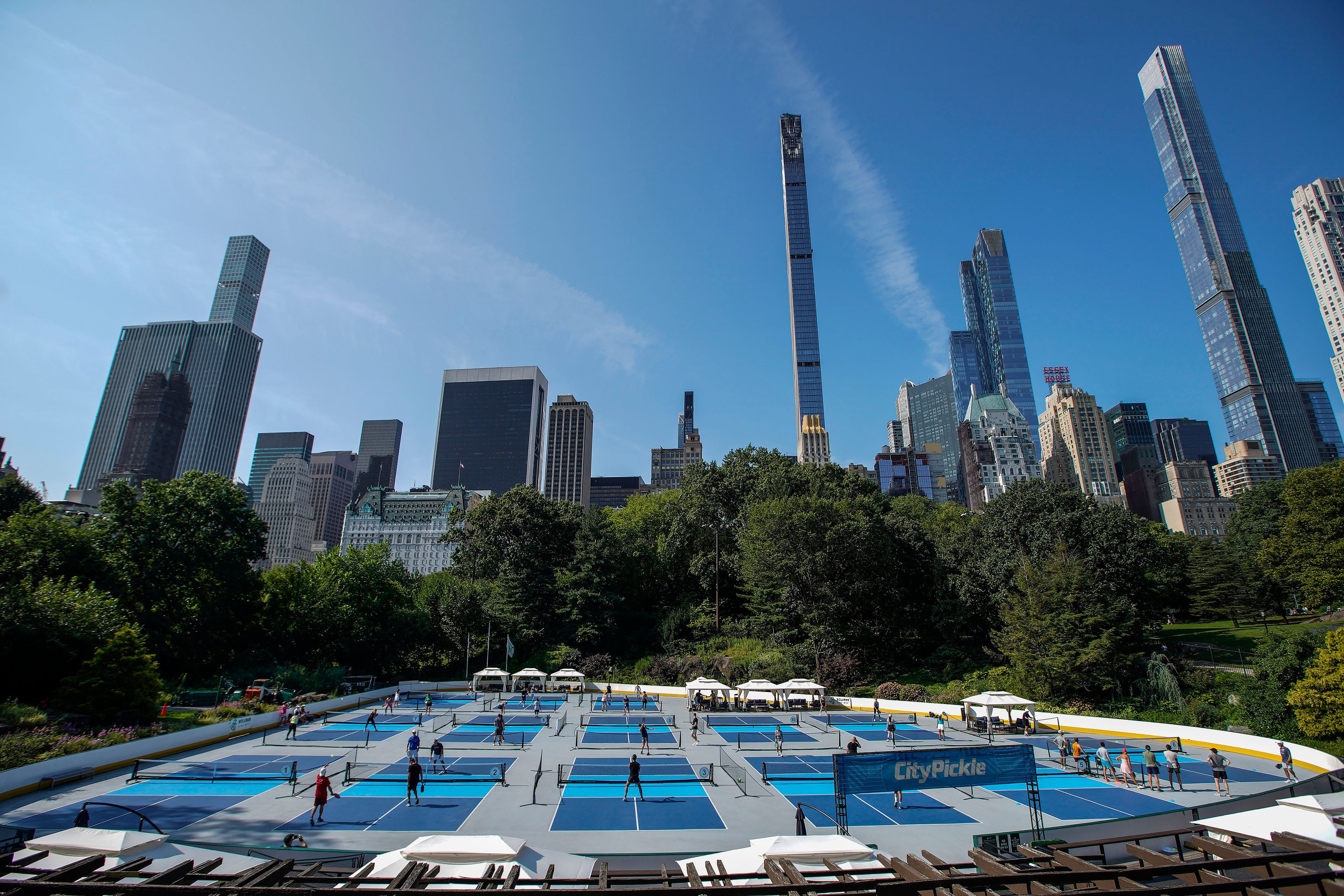 People practice pickleball on the courts of CityPickle at Central Park's Wollman Rink, Saturday, Aug. 24, 2024, in New York. (AP Photo/Eduardo Munoz Alvarez)