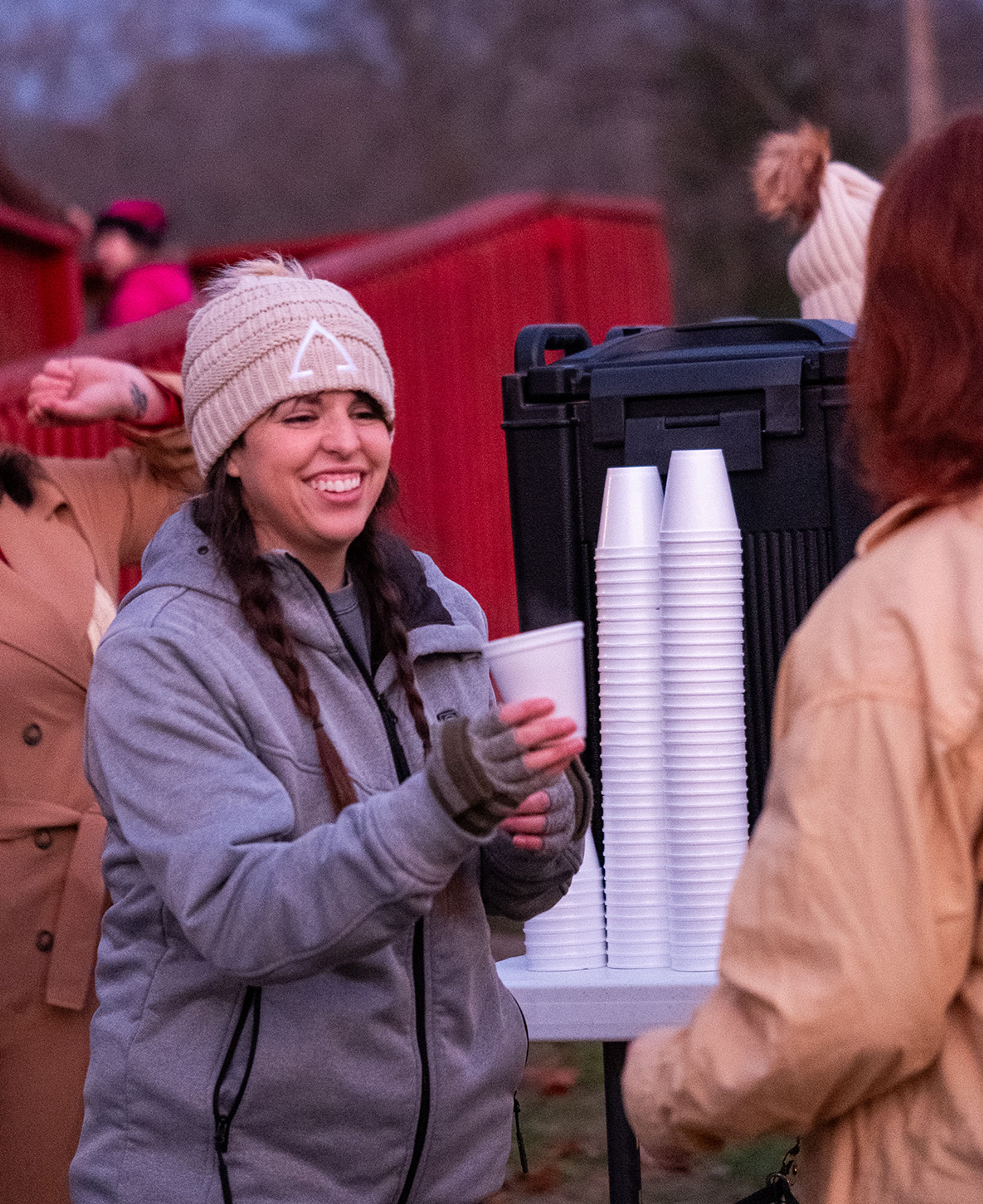 Kayla Brooks of Jackson serves hot cocoa on behalf of Connection Point Church of Bollinger County.