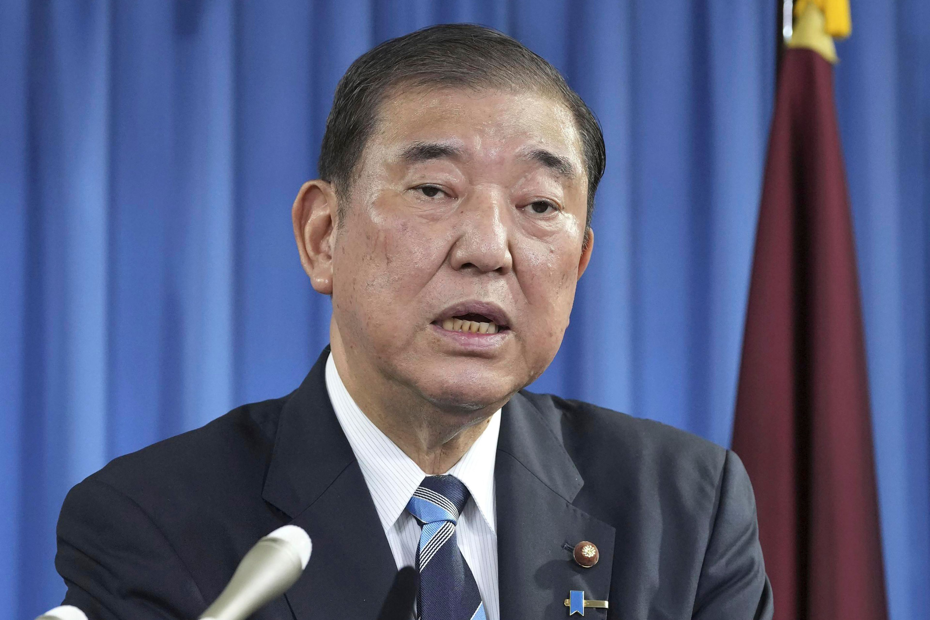 Shigeru Ishiba, the head of Japan's governing party, the Liberal Democratic Party speaks during a press conference at the party's headquarters in Tokyo Monday, Sept. 30, 2024 to announce that he plans to call a parliamentary election on Oct. 27 after he is formally elected as prime minister. (Kyodo News via AP)