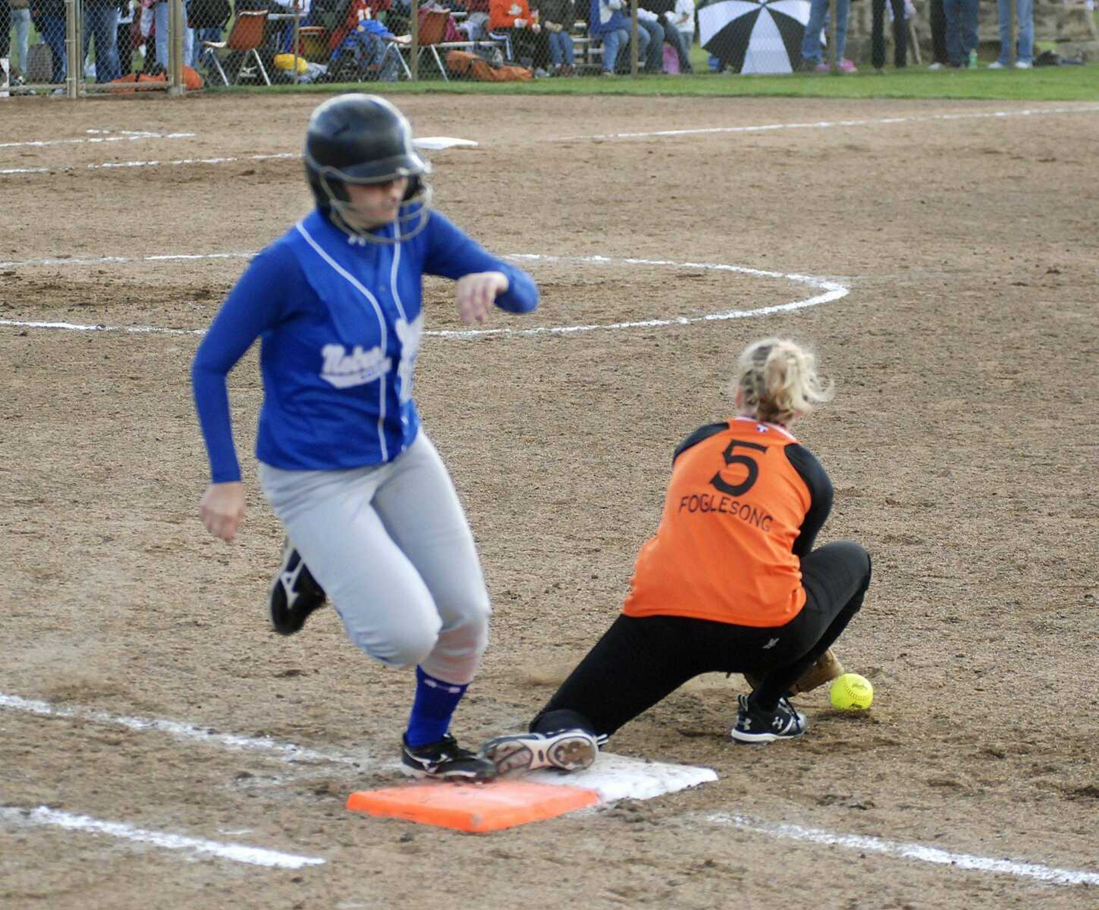 CHUCK WU ~ cwu@semissourian.com
Britney Schott of Notre Dame runs to first base after Kirksville first baseman miss handle the ball.