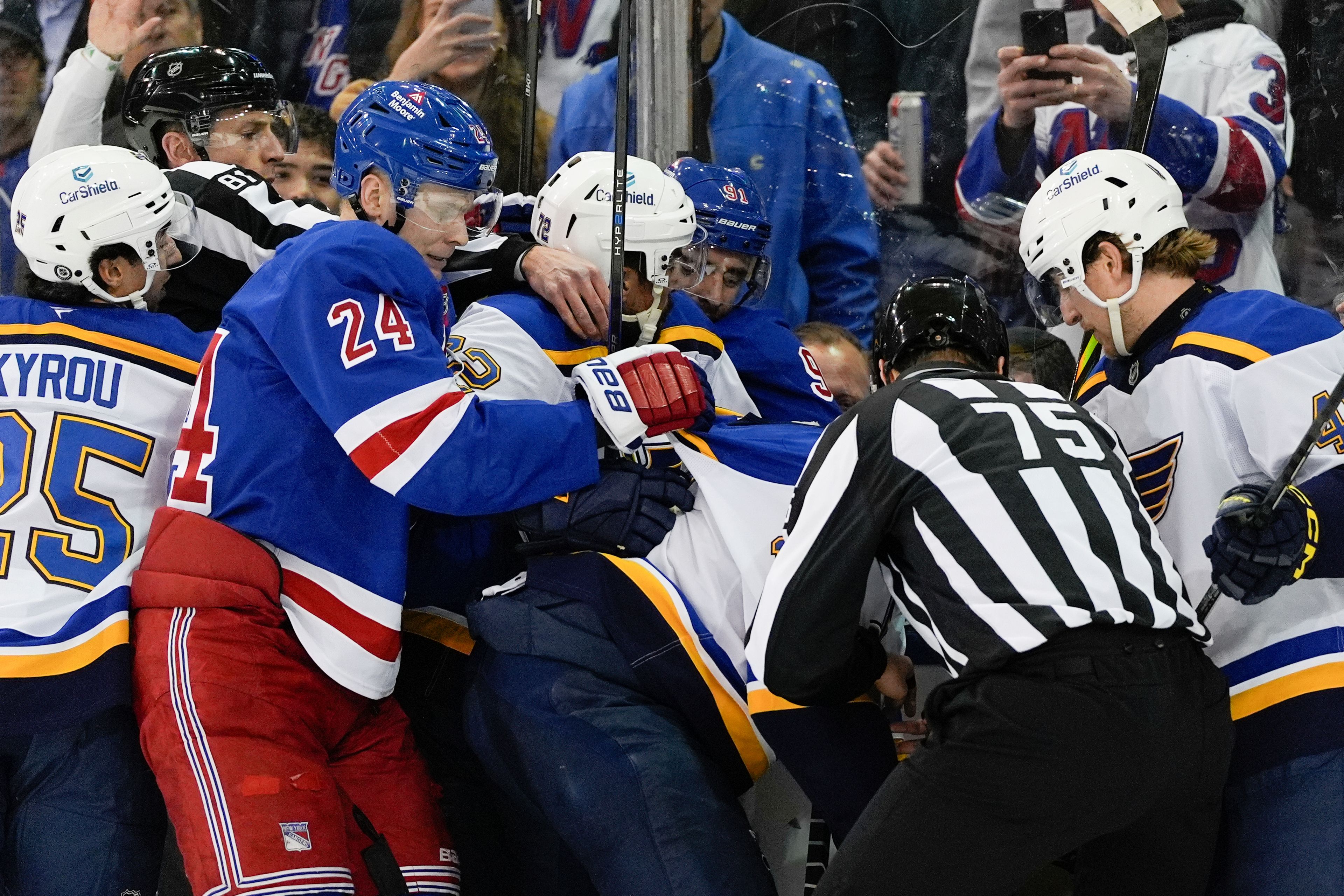 St. Louis Blues center Jordan Kyrou, defensemen Justin Faulk and Scott Perunovich, New York Rangers right wings Reilly Smith and Kaapo Kakko and other players fight during the first period of an NHL hockey game, Monday, Nov. 25, 2024, in New York. (AP Photo/Julia Demaree Nikhinson)