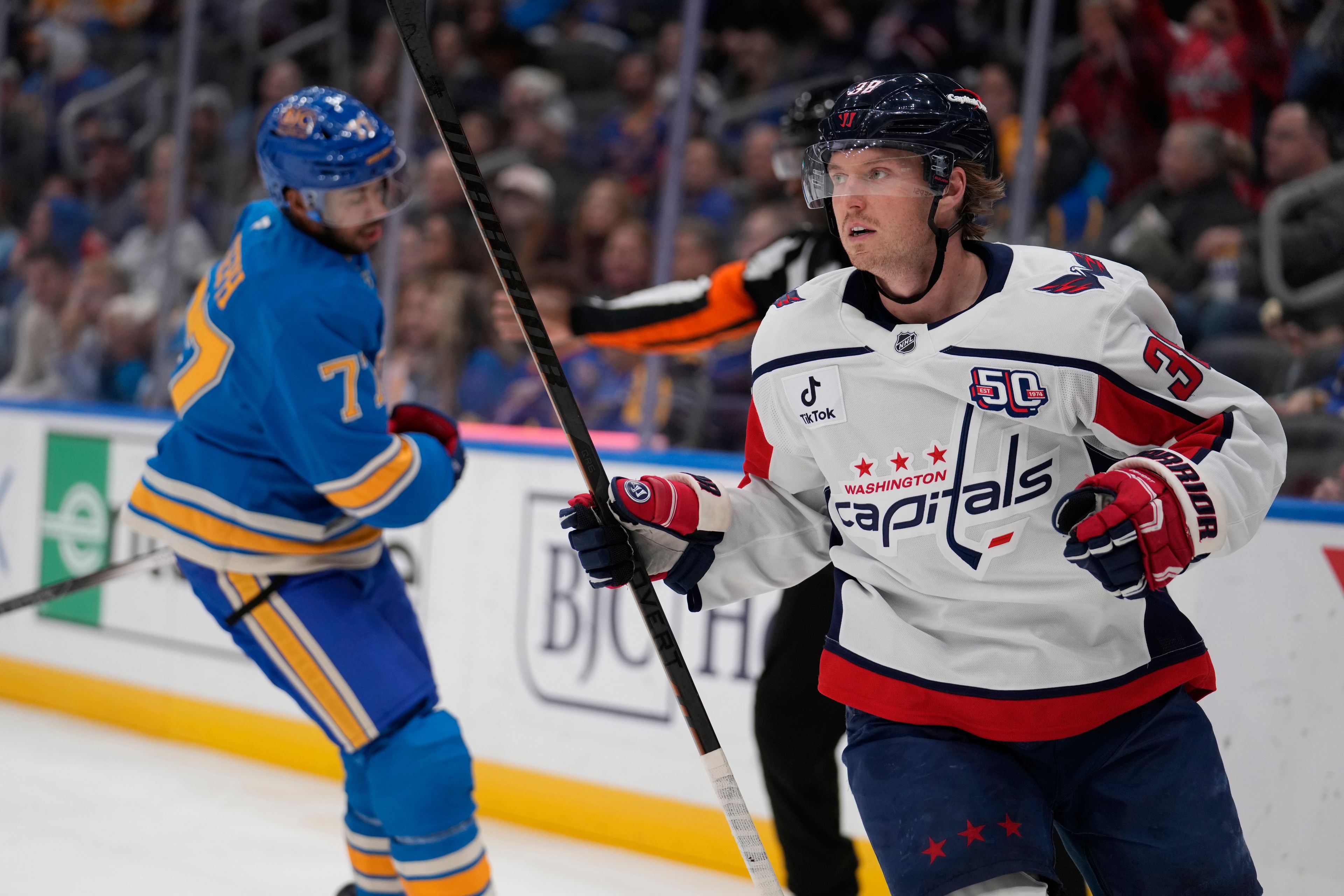 Washington Capitals' Rasmus Sandin, right, celebrates after scoring as St. Louis Blues' Pierre-Olivier Joseph skates in the background during the third period of an NHL hockey game Saturday, Nov. 9, 2024, in St. Louis. (AP Photo/Jeff Roberson)