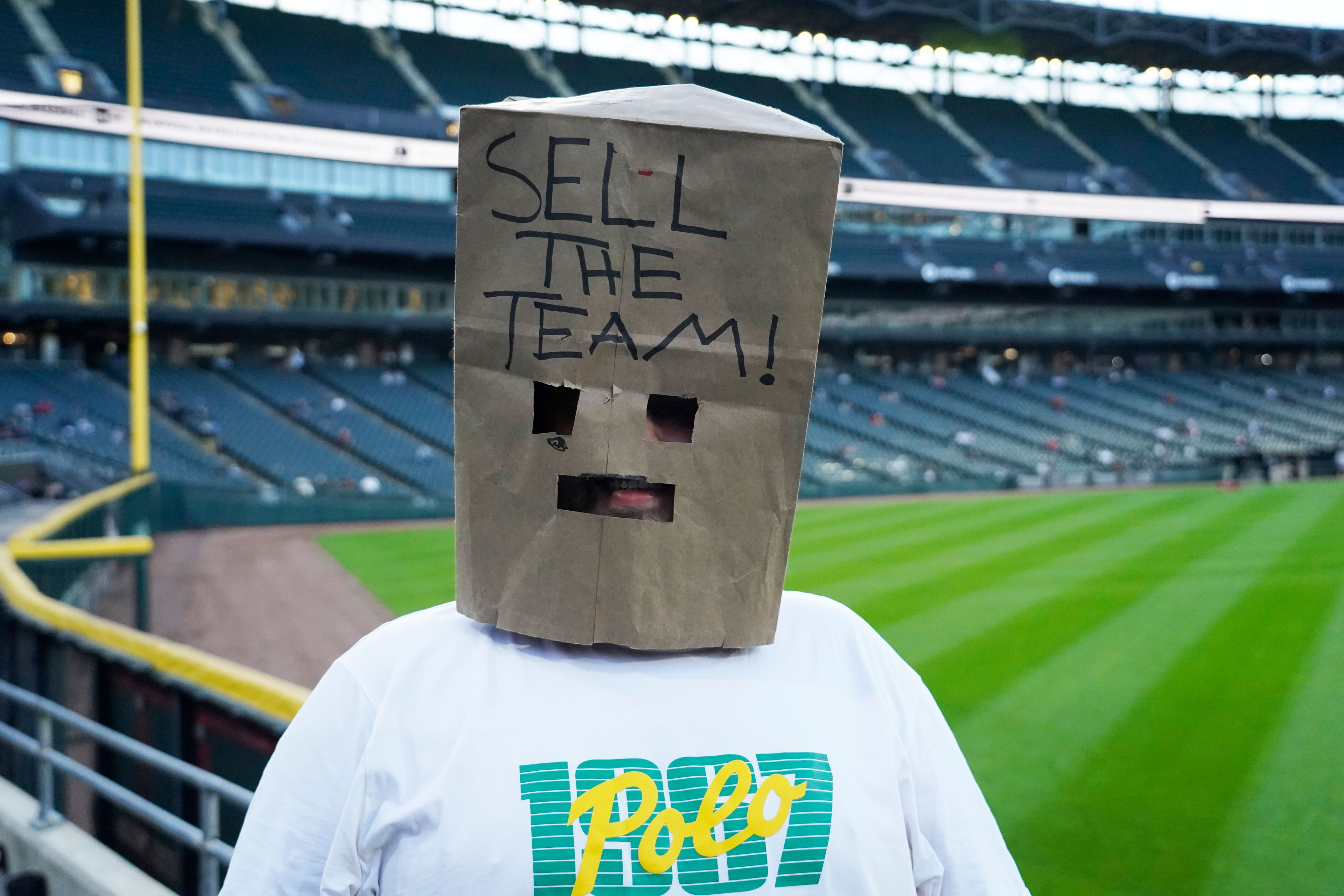 Christian Landreth from Glen Ellyn Illinois wears a bag on his head before a baseball game between the Chicago White Sox and the Los Angeles Angels. The White Sox are going for the MLB record for loses122 if they lose tonight, Wednesday, Sept. 25, 2024, in Chicago. (AP Photo/David Banks)