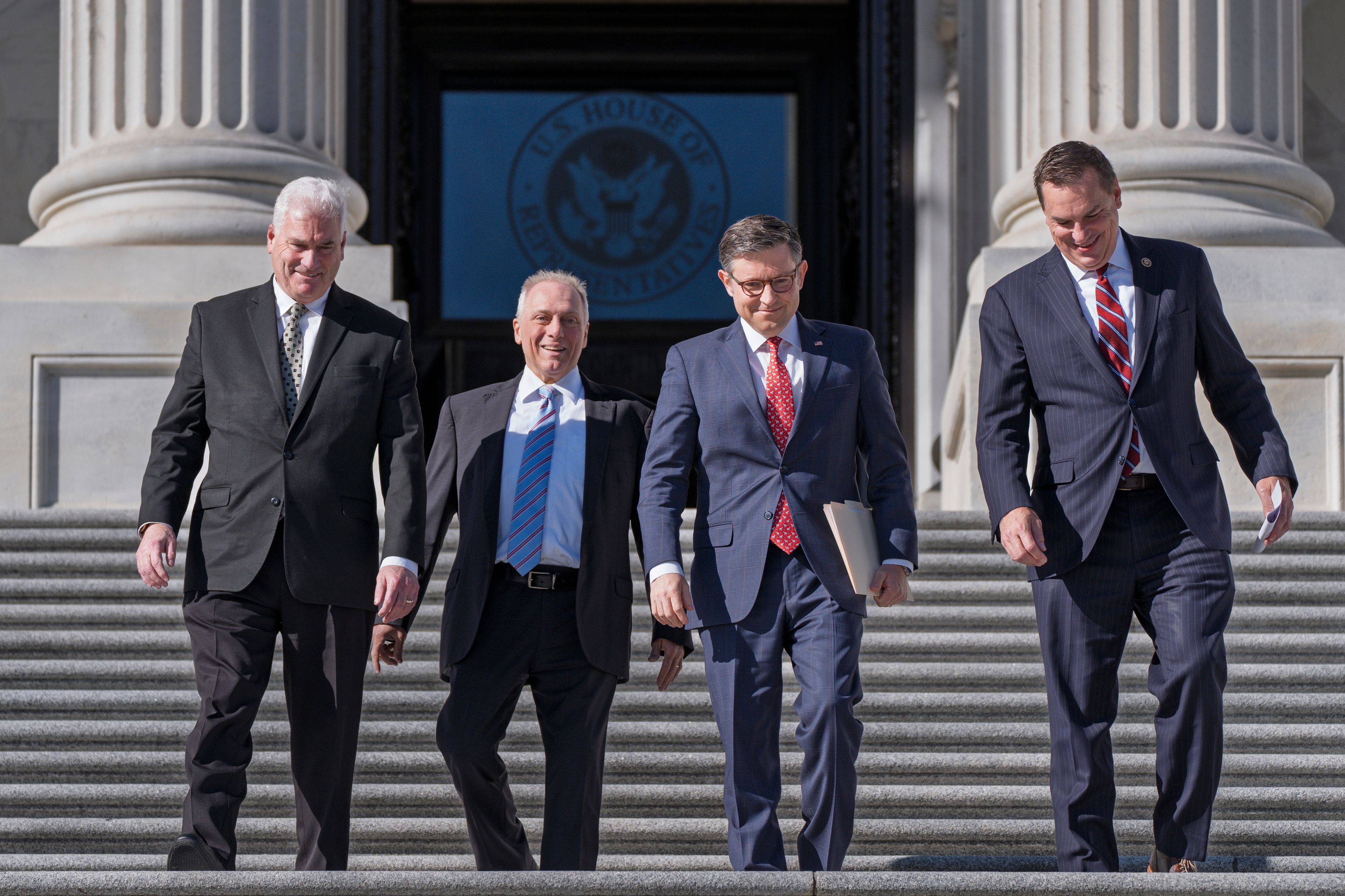 House Republican leaders, from left, Majority Whip Tom Emmer, R-Minn., Majority Leader Steve Scalise, R-La., Speaker of the House Mike Johnson, R-La., and Rep. Richard Hudson, R-N.C., chairman of the National Republican Congressional Committee, arrive to tout Republican wins and meet with reporters on the steps of the Capitol in Washington, Tuesday, Nov. 12, 2024. Congress returns to work this week to begin what is known as a lame-duck session — that period between Election Day and the end of the two-year congressional term. (AP Photo/J. Scott Applewhite)