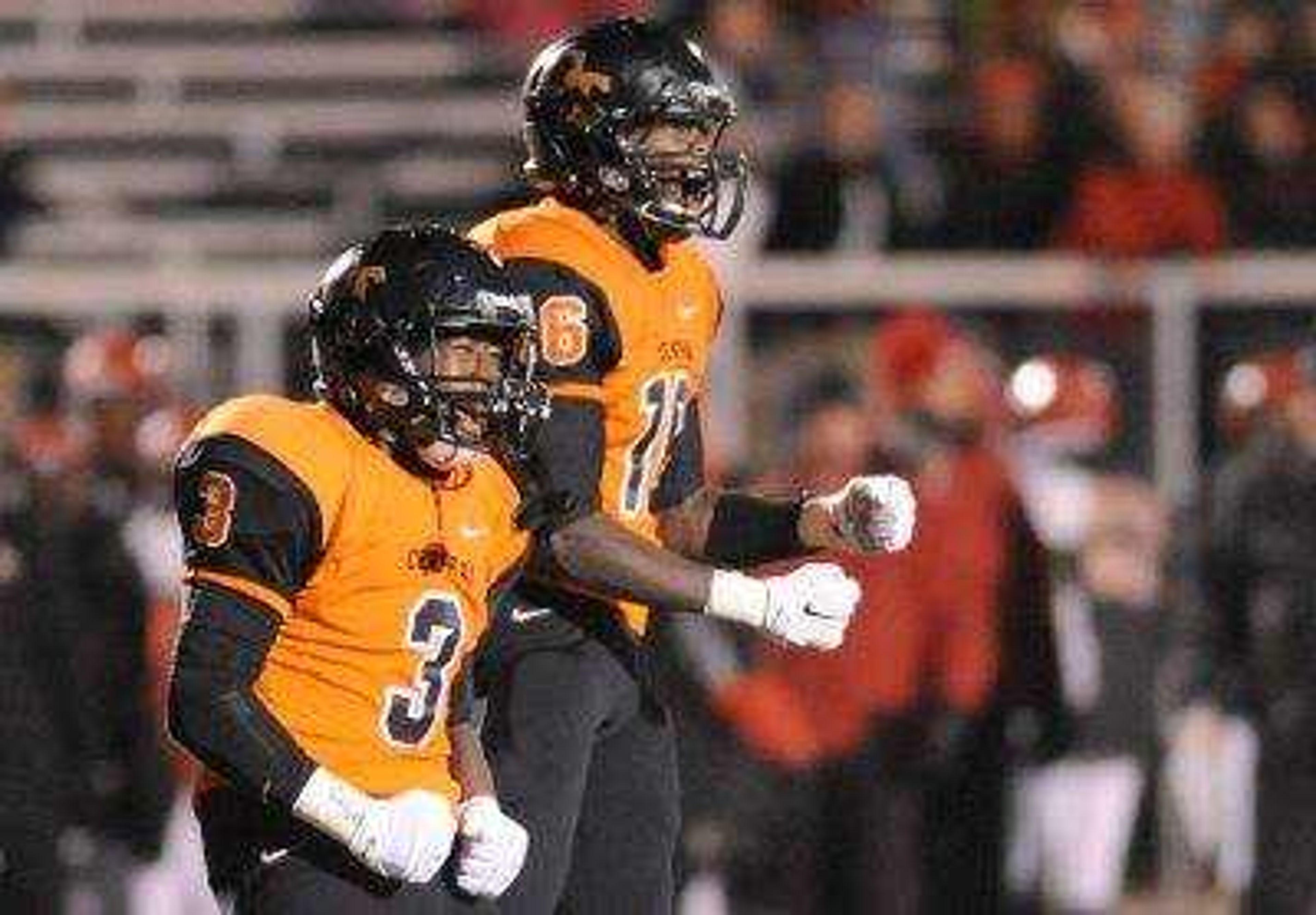 Central's Jalen Reddin and Jordan Franklin celebrate after holding Sikeston at the one yard line in the first quarter of the Class 4 District 1 semifinals Friday, Oct. 31, 2014 at Central. (Glenn Landberg)