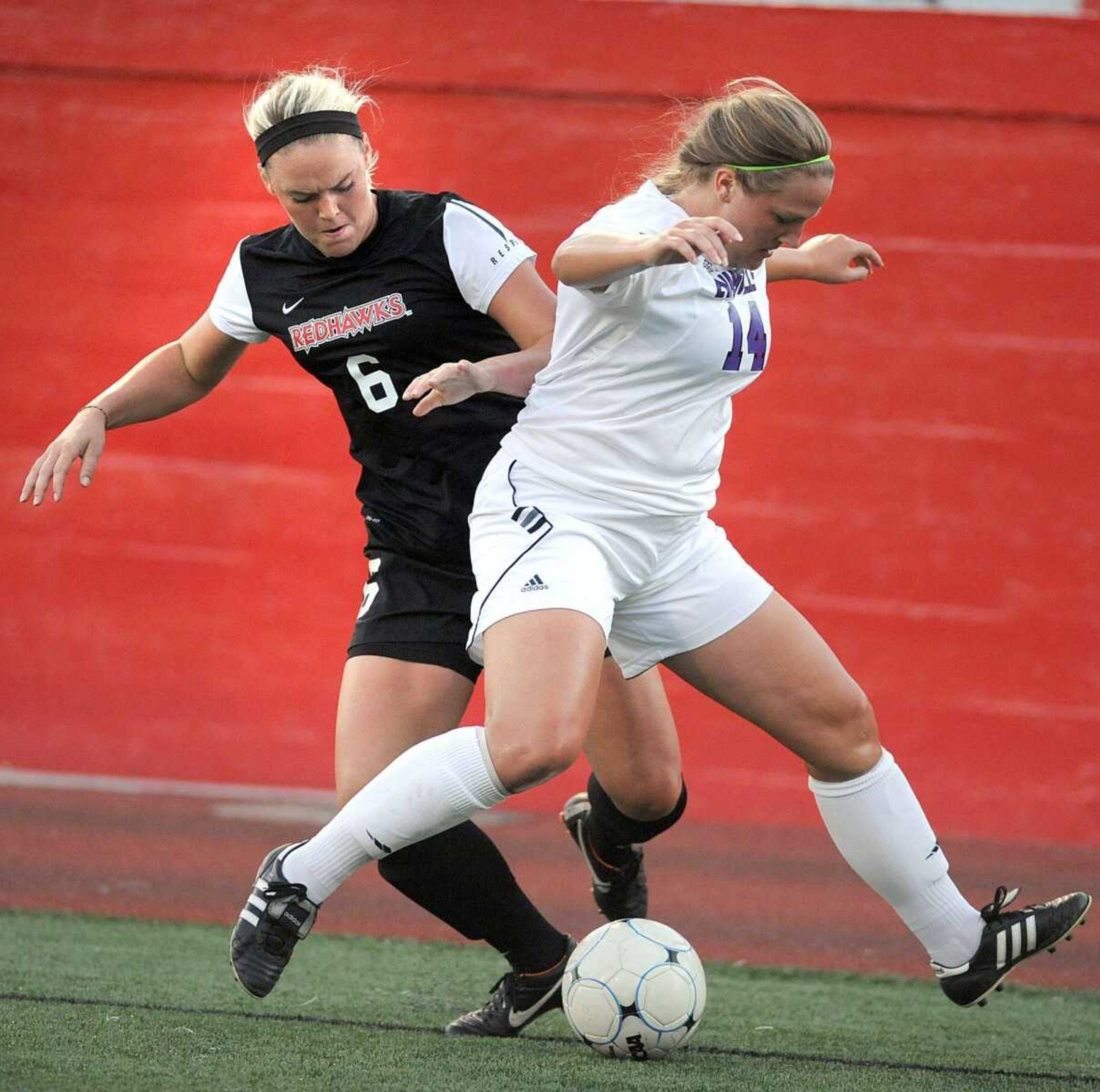 Southeast Missouri State&#8217;s Courtney Luehmann takes control of the ball from Evansville&#8217;s Kasey Cartwright during the first half Tuesday at Houck Stadium. (Laura Simon)