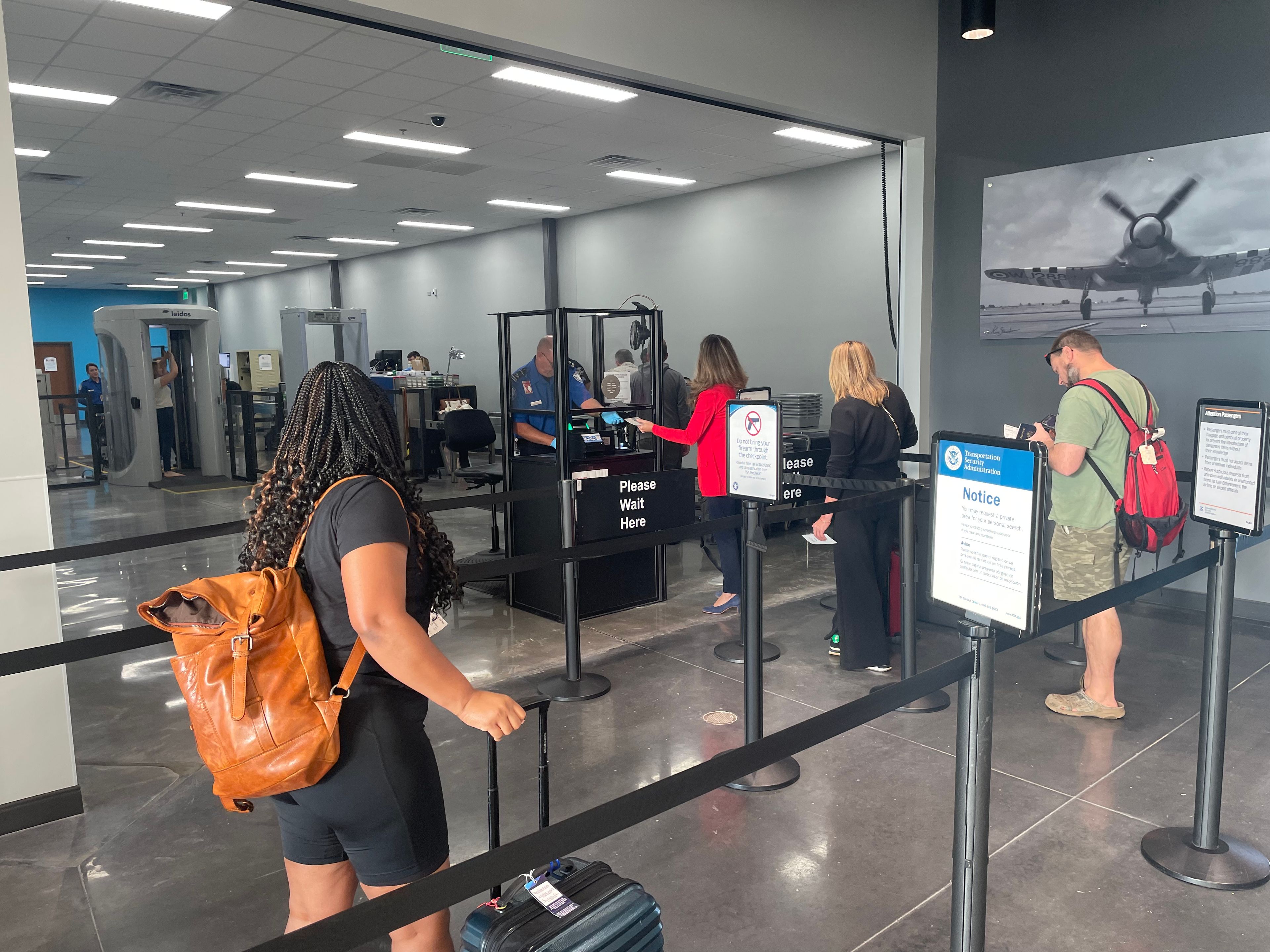 The facility includes spacious waiting areas, upgraded security checkpoints, and a new Pilot House restaurant. Passengers on the first Contour flight to Chicago go through the security checkpoint on Oct. 1, 2024.