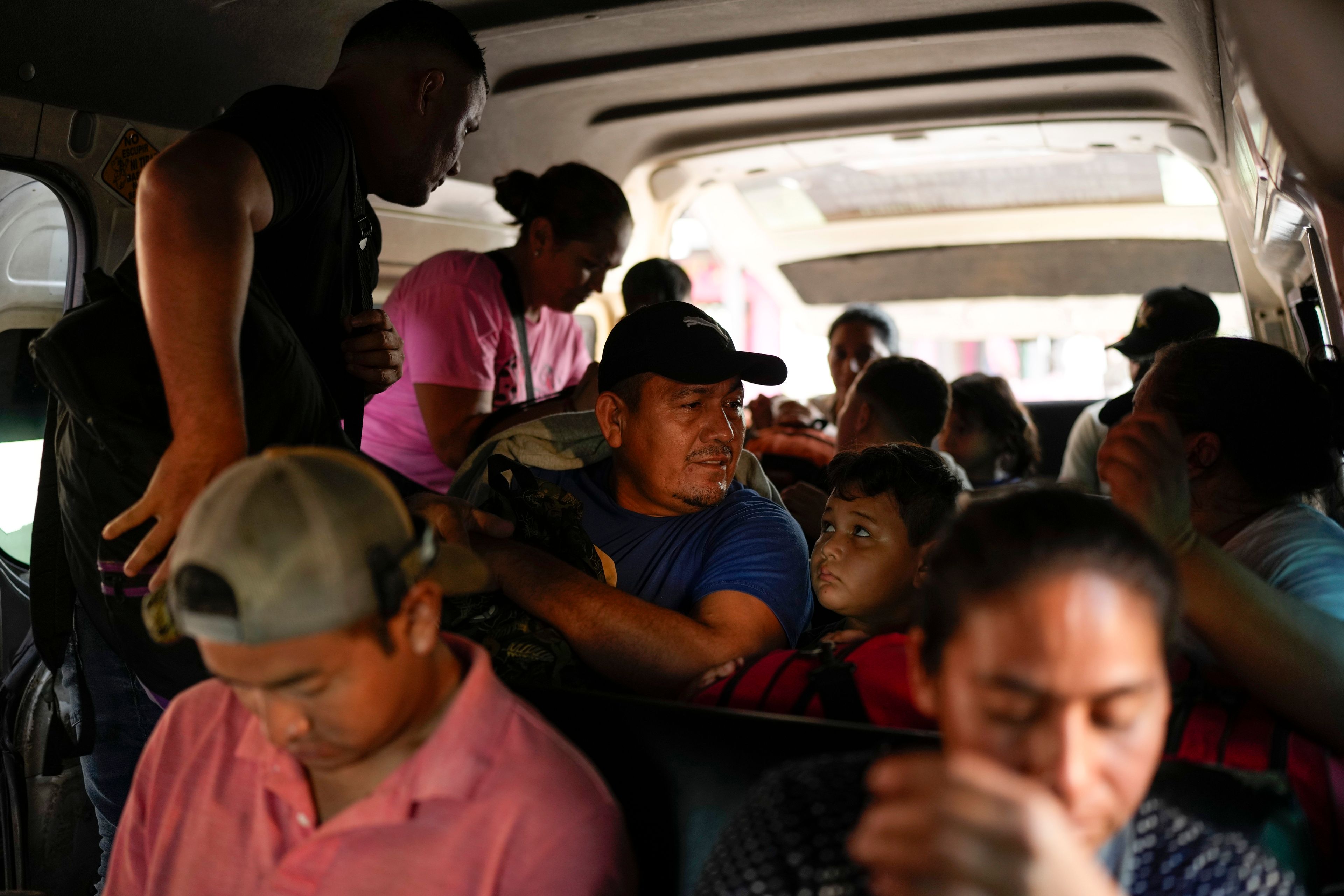 Honduran migrant Luis Alonso Valle, center, sits in a car on his to Tapachula from Ciudad Hidalgo, Mexico, after crossing the Suchiate River with his family from Guatemala, Monday, Oct. 28, 2024. (AP Photo/Matias Delacroix)