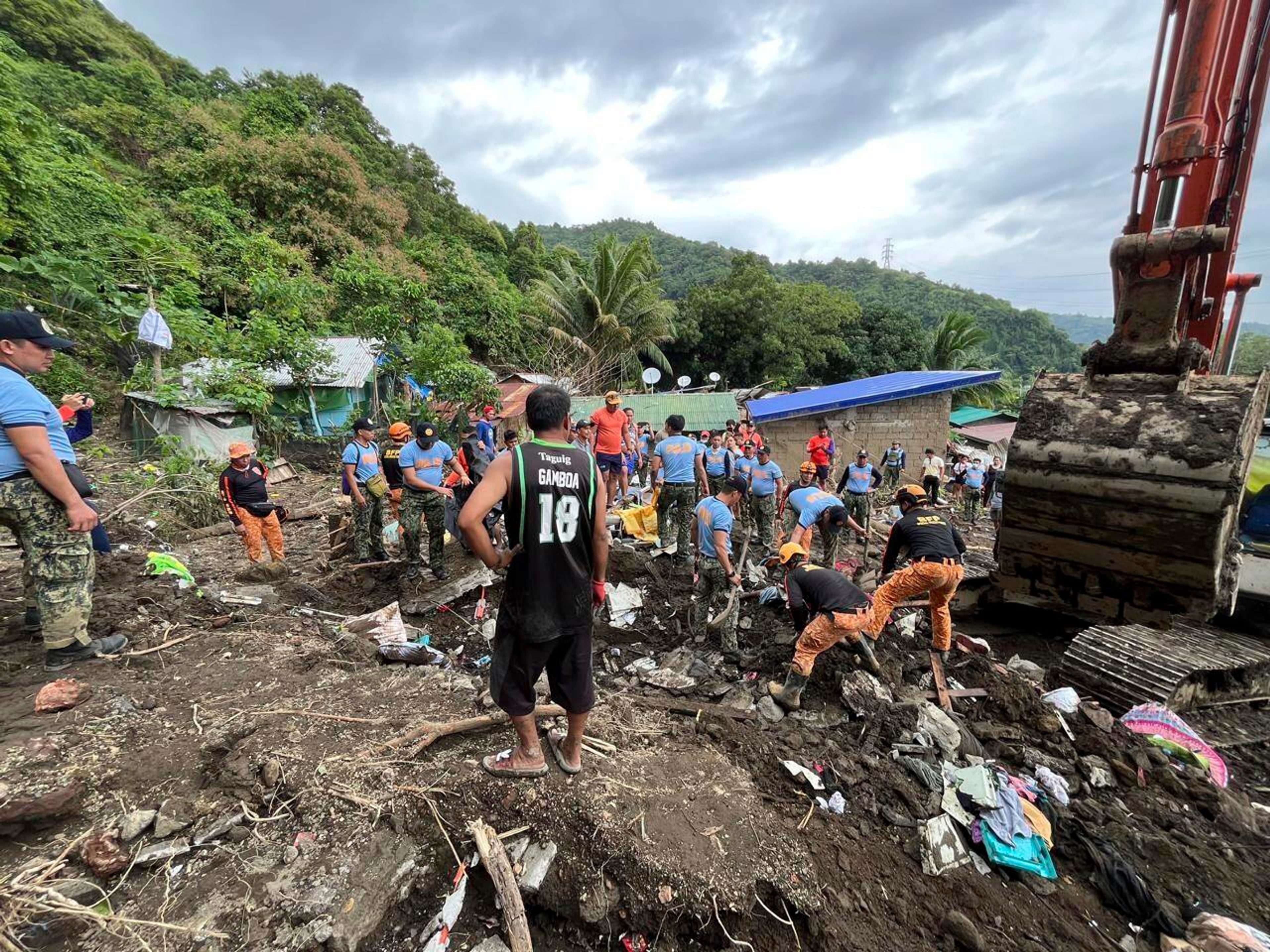 Volunteers continue rescue operations after a recent landslide triggered by Tropical Storm Trami struck Talisay, Batangas province, Philippines leaving thousands homeless and several villagers dead on Saturday, Oct. 26, 2024. (AP Photo/Jim Gomez)