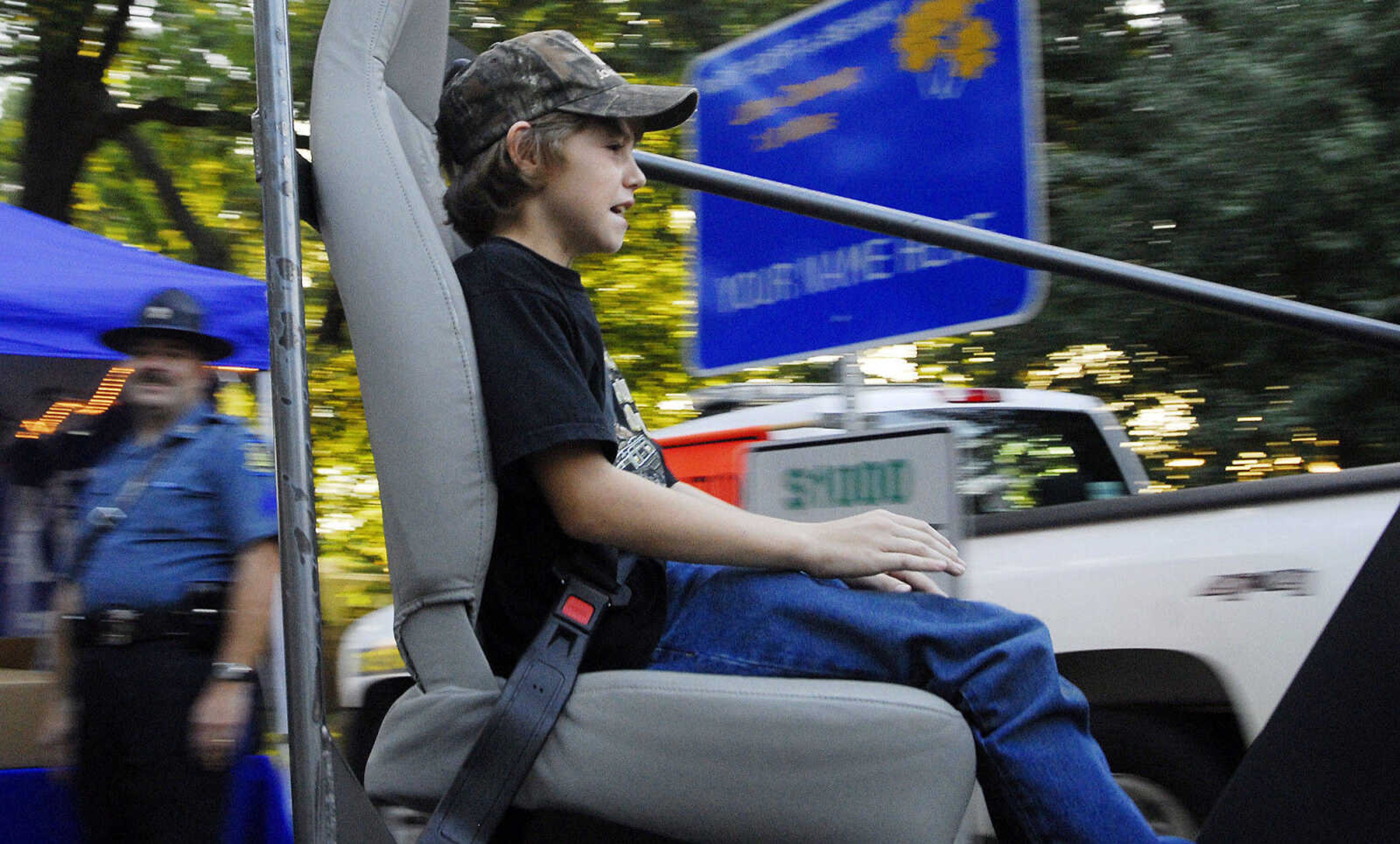 LAURA SIMON~lsimon@semissourian.com
Michael Hart rides the 5mph crash simulator Thursday, September 16, 2010 during the 155th Annual SEMO District Fair.