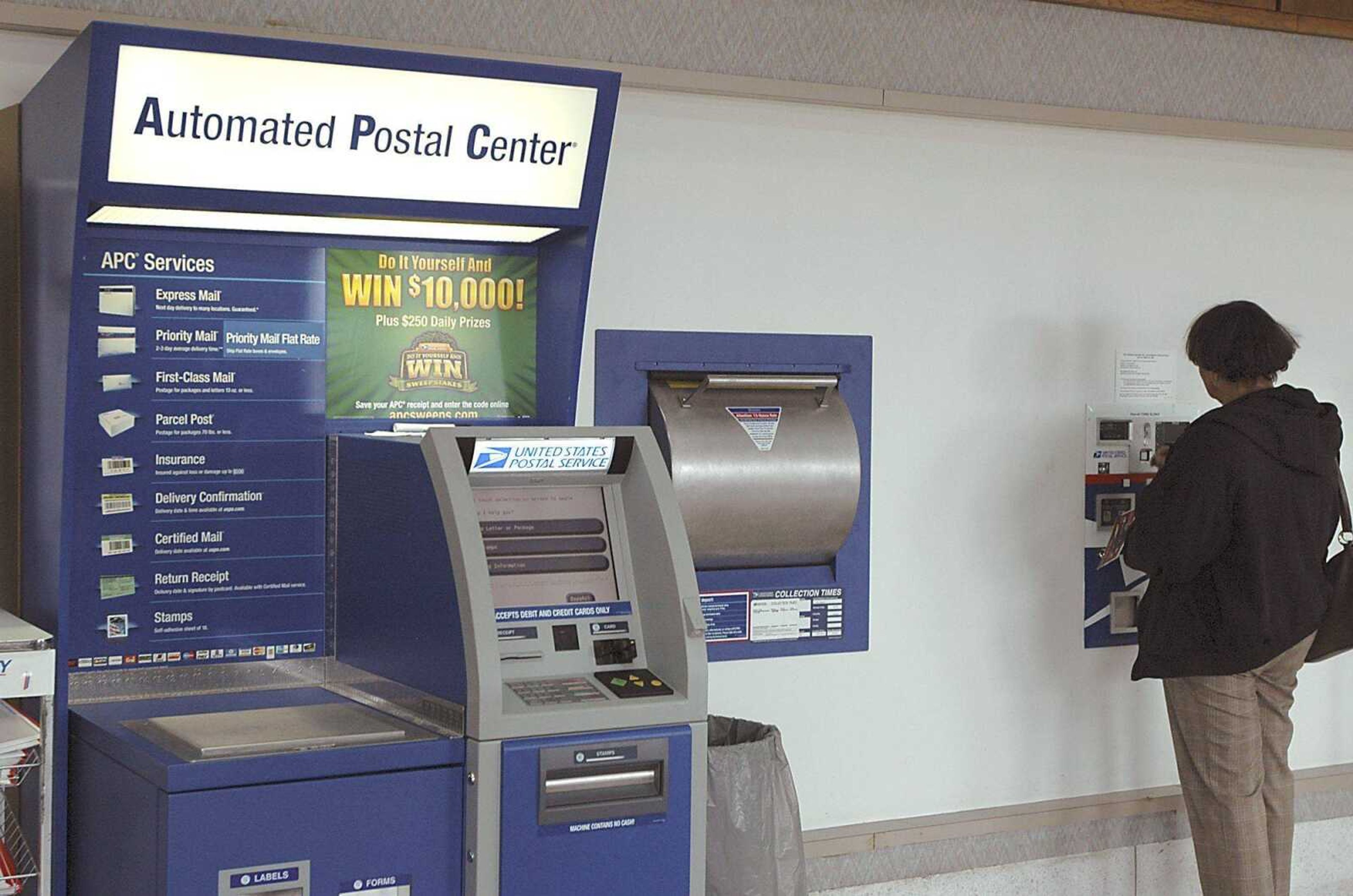 People who use the Automated Postal Center in Carbondale, Ill., say it is fast and convenient, but most said they prefer to talk to a real person or use the old stamp machine, which will be removed by the end of the month.  The APC has been in Carbondale since 2004. (Lindy Bavolek)