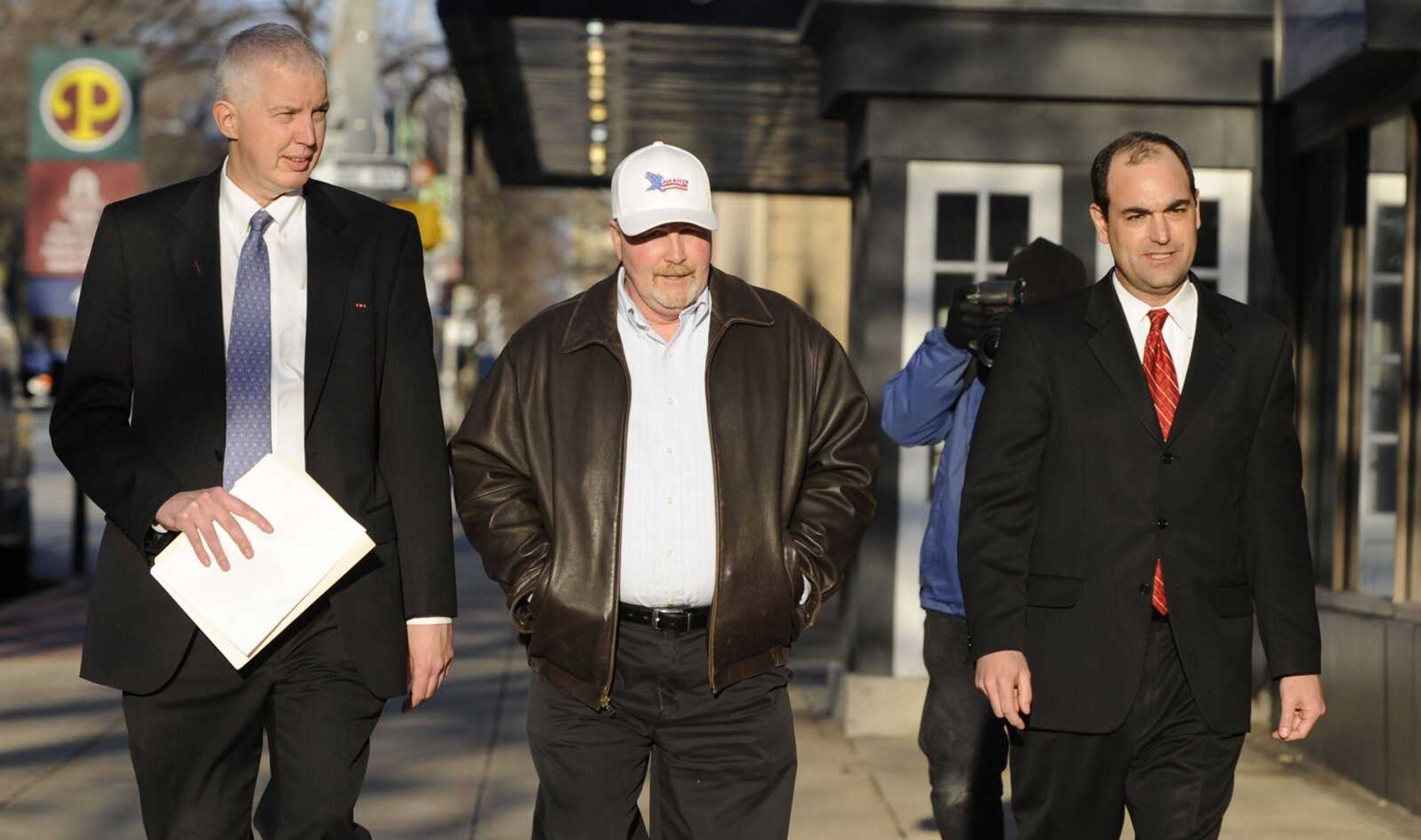 Albert Snyder, center, flanked by his attorneys Craig Trebilock, left and Sean Summers, walk to a news conference following the Supreme Court's ruling in favor of the Westboro Baptist Church, Wednesday, March 2, 2011 in York, Pa. The 8-1 decision ended Snyder's lawsuit, who sued members of the fundamentalist church for the emotional pain they caused by showing up at his son Matthew's funeral. (AP Photo/Bradley C Bower)