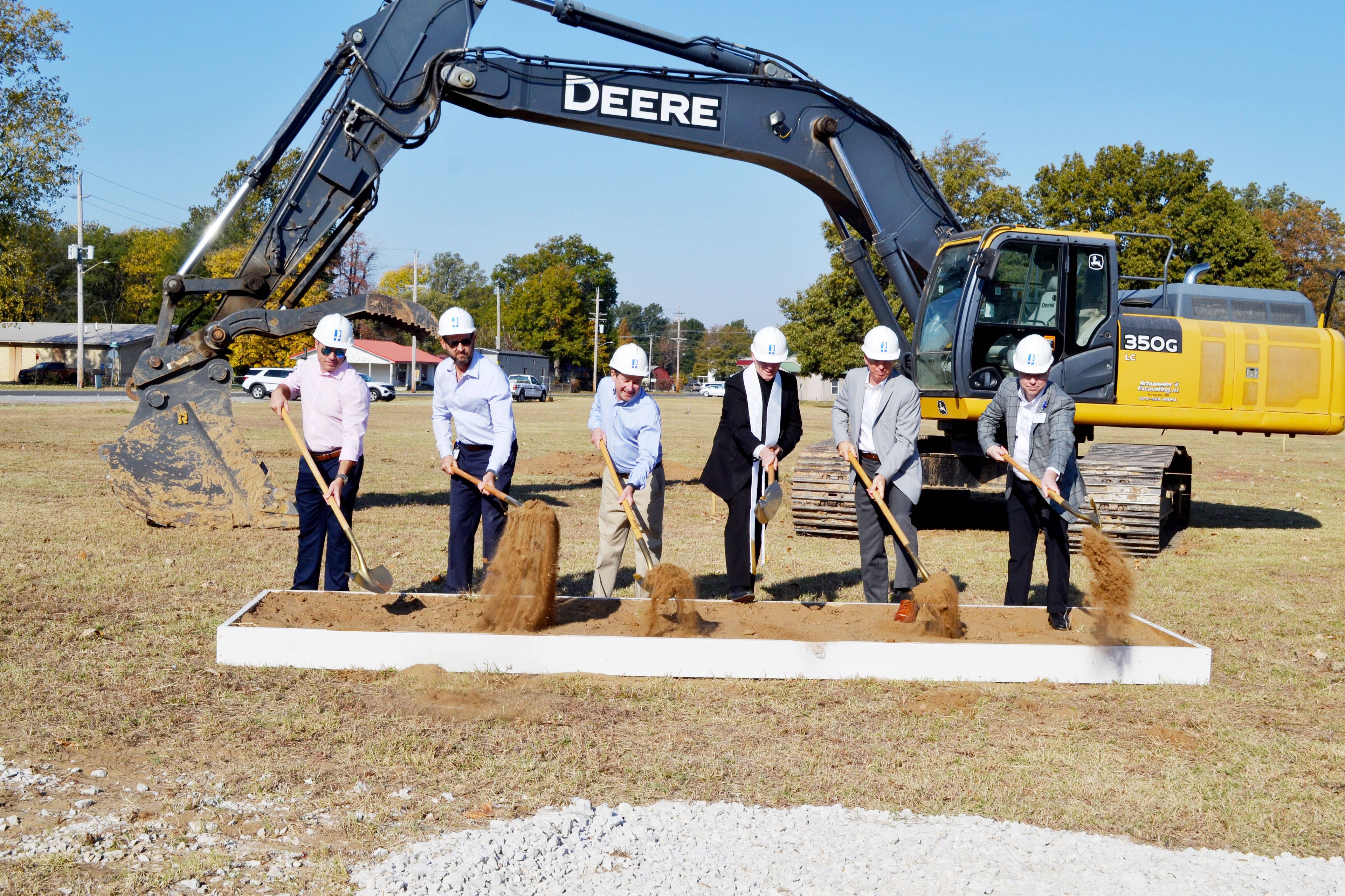 Turning dirt are, from left, Paul Findlay of Robinson Construction; Dr. Steven Douglas; East Prairie Mayor Kevin Mainord; the Most Rev. Bishop Edward M. Rice; Steve Dirnberger, chairman on Saint Francis Healthcare System Board; and Justin Davison, CEO of Saint Francis Healthcare System.