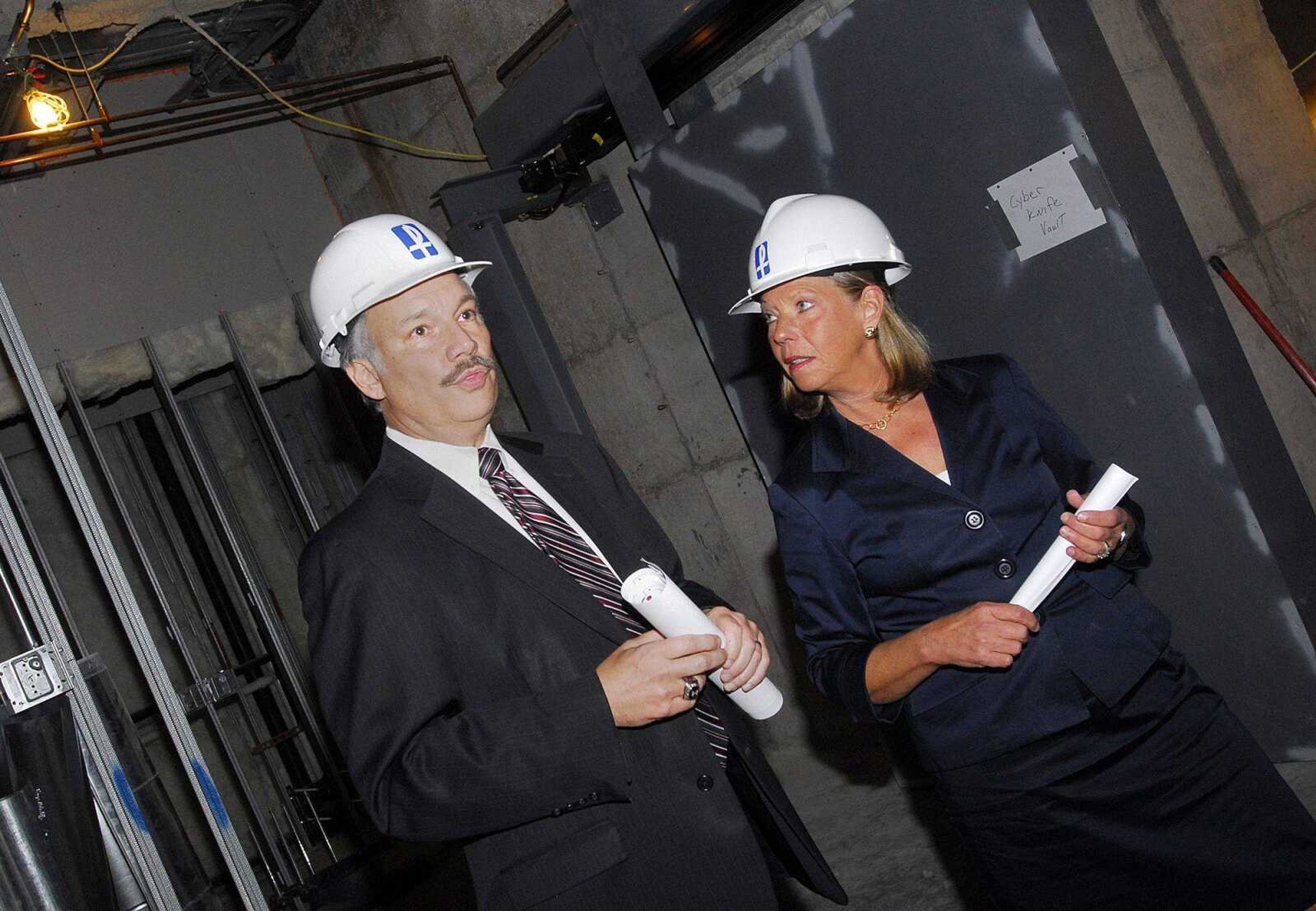 Rep. Jo Ann Emerson listens as Saint Francis Medical Center CEO Steve Bjelich leads a tour of the hospital's new Heart Hospital and Cancer Institute on Thursday. (Laura Simon)