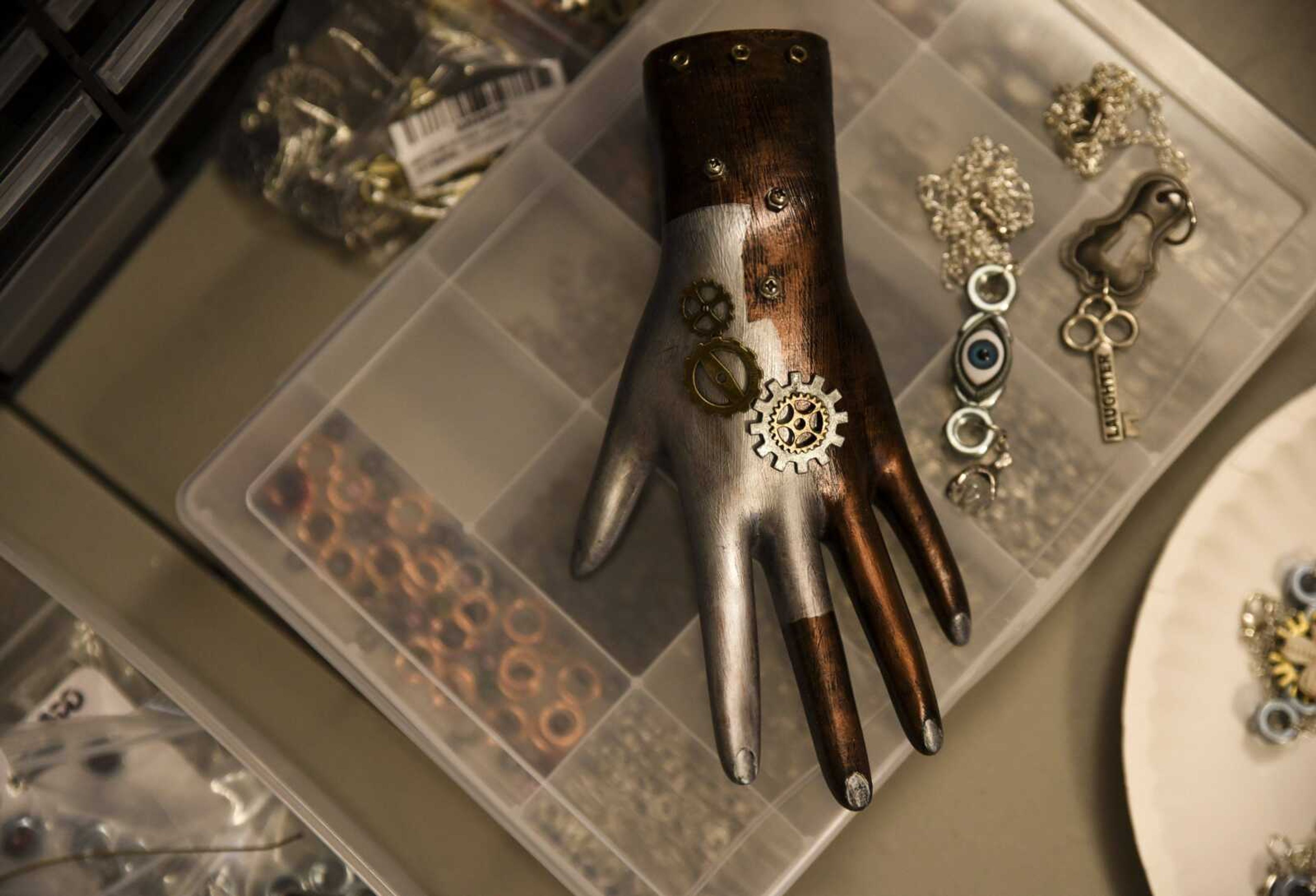 A steampunk-themed decorative hand sits on the desk of Brittany Colbert in her Jackson home studio March 29.