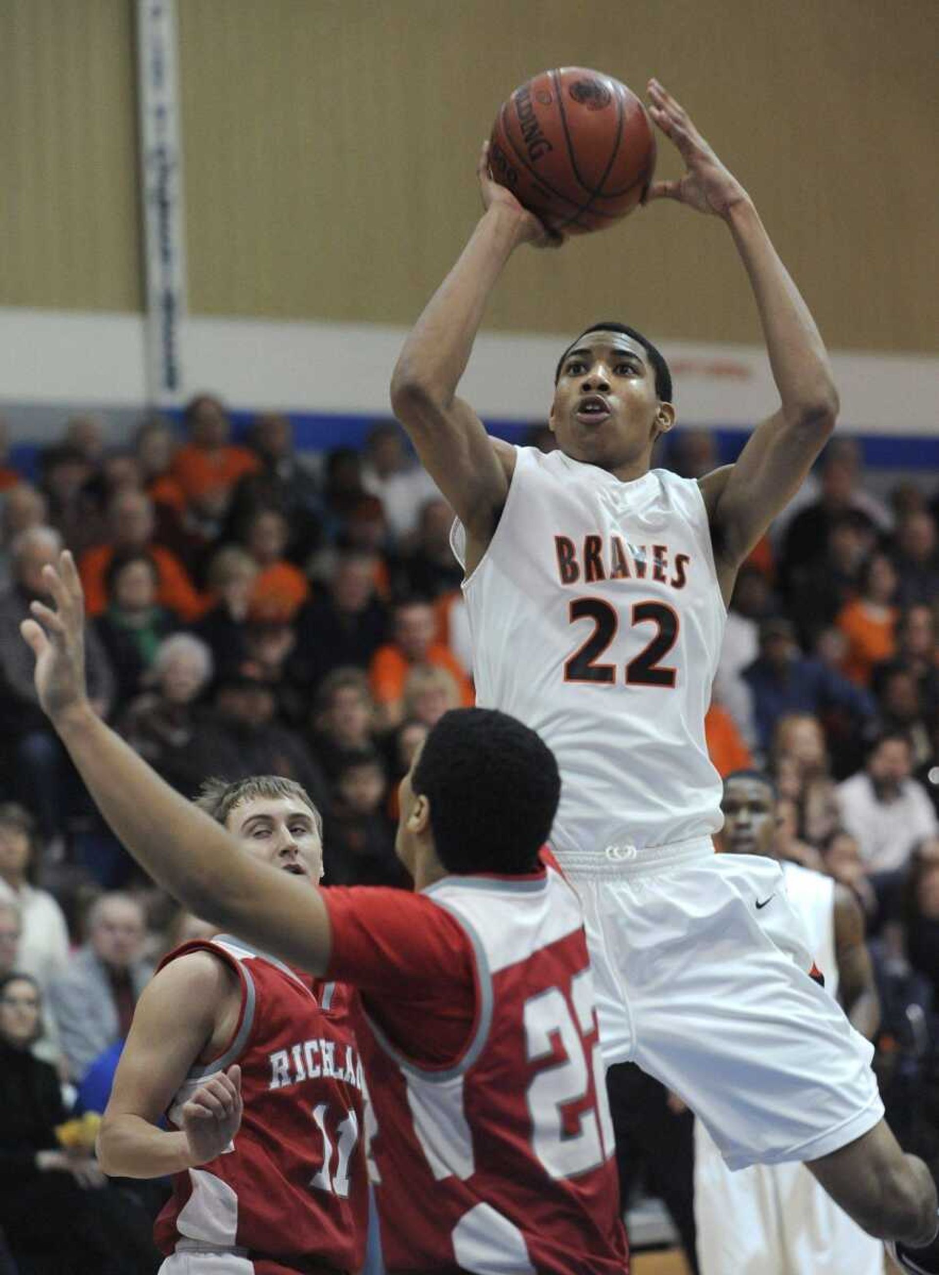 Scott County Central's Otto Porter shoots over Richland's Andrew Thorton during the first quarter of the Class 1 District 3 championship game earlier this month in Delta, Mo. (Fred Lynch)