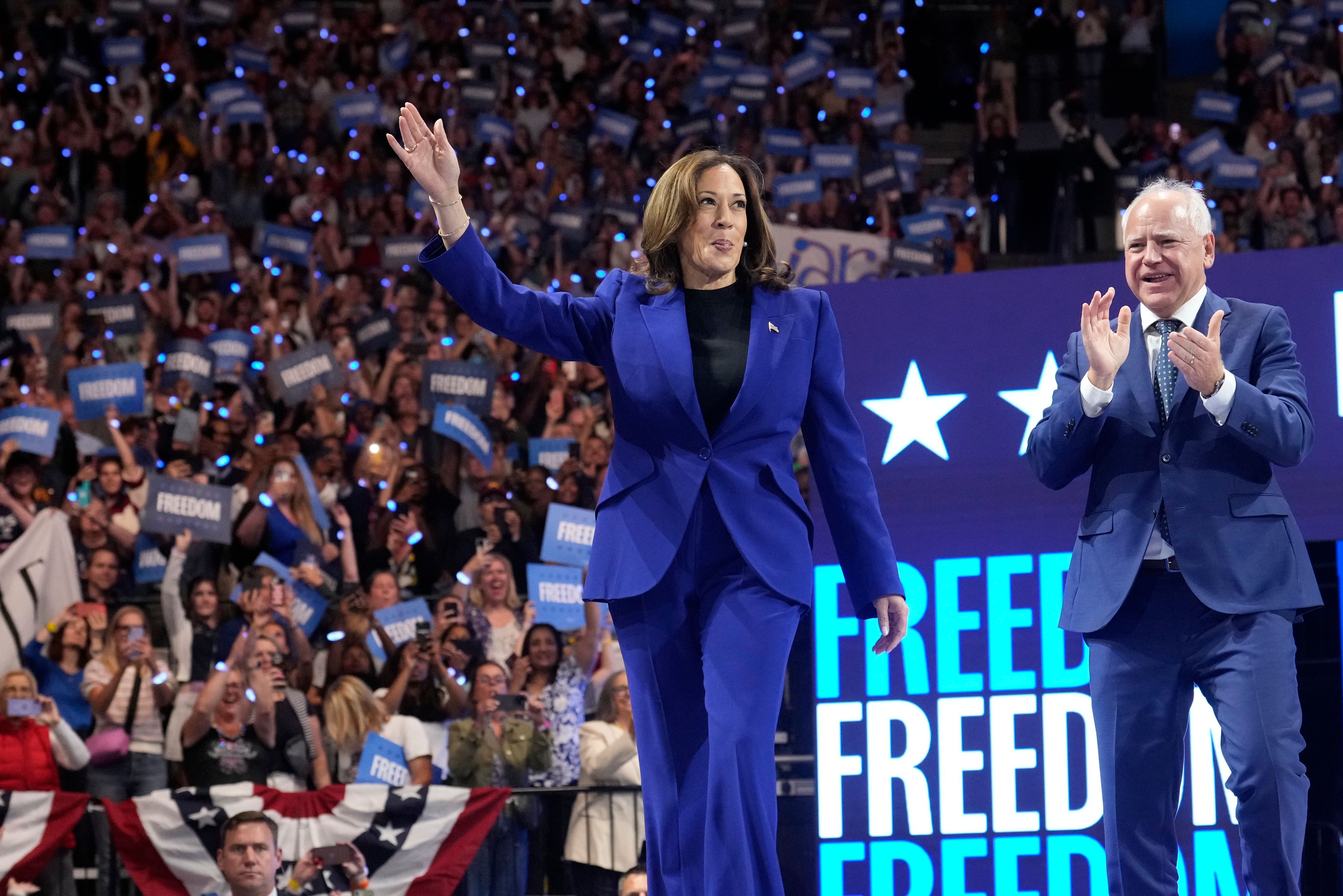 Democratic presidential nominee Vice President Kamala Harris arrives with running mate Minnesota Gov. Tim Walz at the Fiserv Forum during a campaign rally in Milwaukee, Tuesday, Aug. 20, 2024. (AP Photo/Jacquelyn Martin)