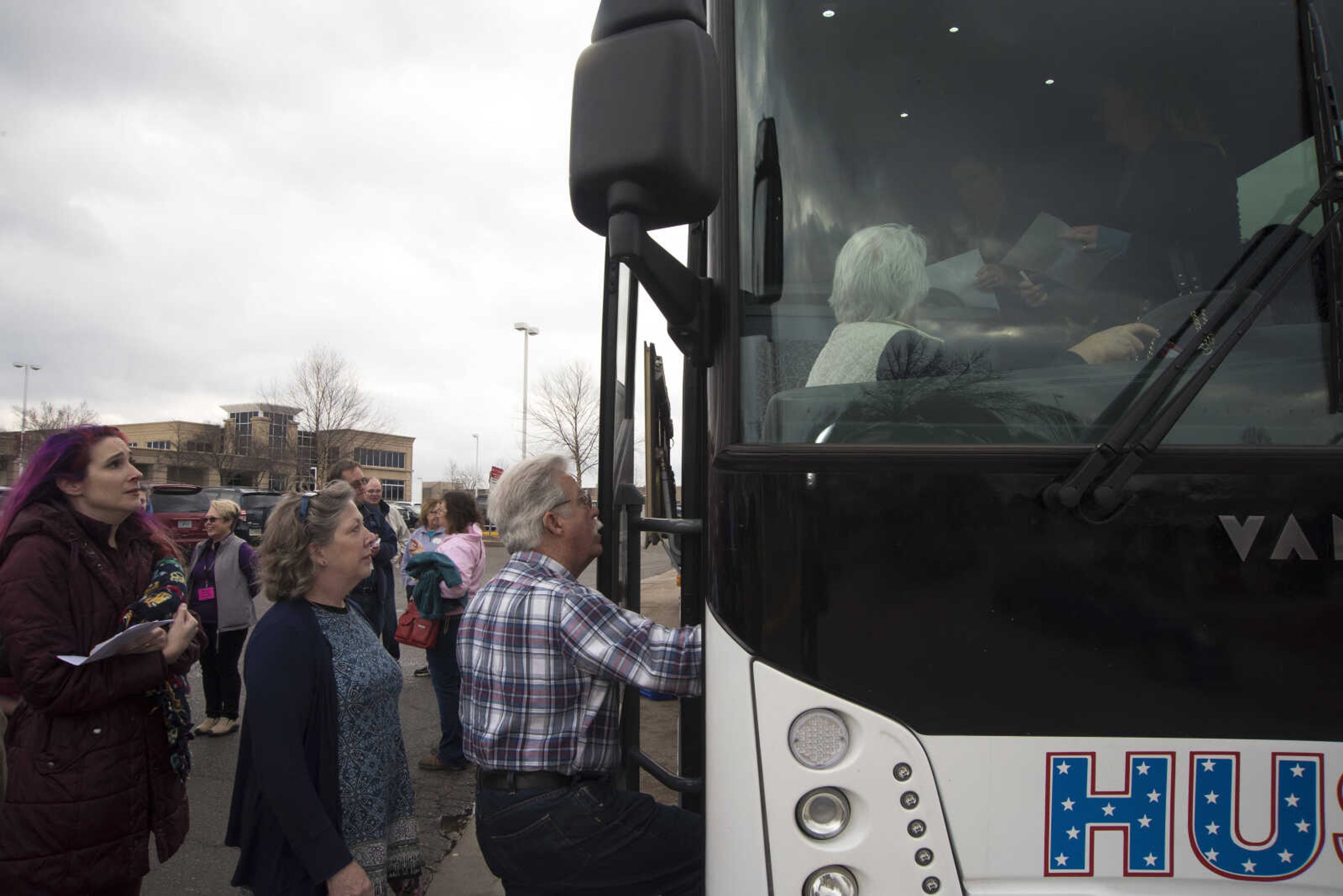 Protestors get ready to travel to Washington D.C. to participate in the Women's March on Saturday as they get ready to leave Friday, Jan. 20, 2017 in the Scully Building parking lot at Southeast Missouri State University in Cape Girardeau.