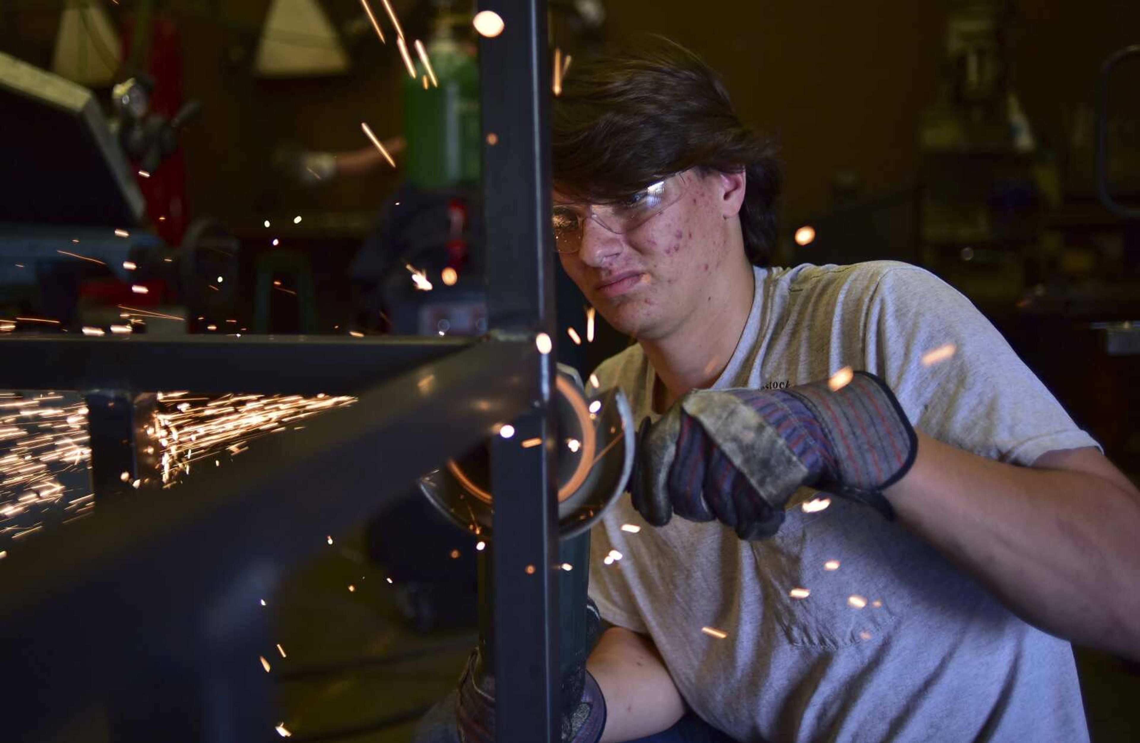 Dalton Scott, 17, smoothes out welded metal to be built for a deer blind capable for hunters with disabilities Tuesday, Oct. 25, 2016 at the Career and Technology Center in Cape Girardeau.