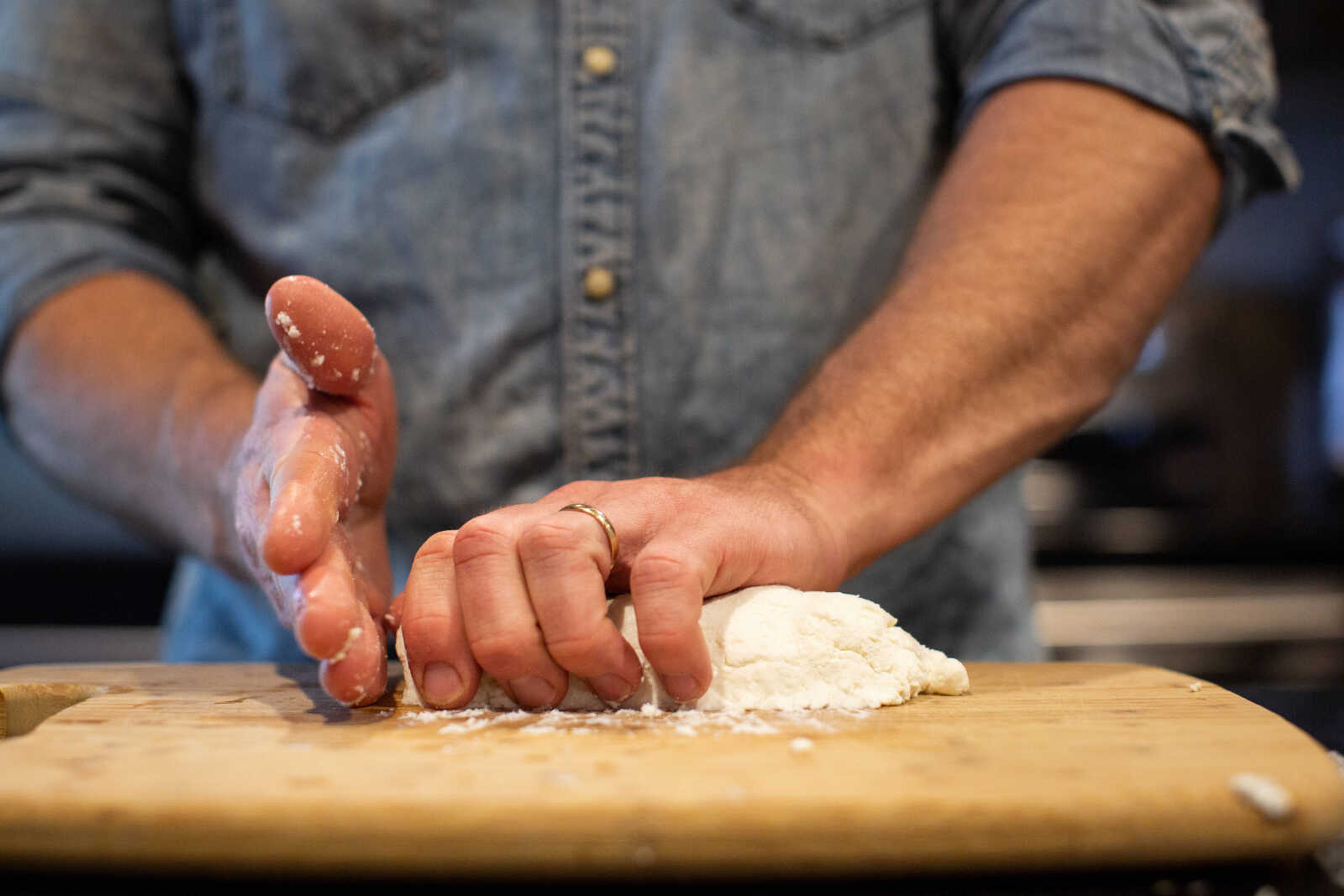 Trever Duncan shapes a log of chèvre. Trever seasons the cheese with wood ash, salt or herbs de Provence.